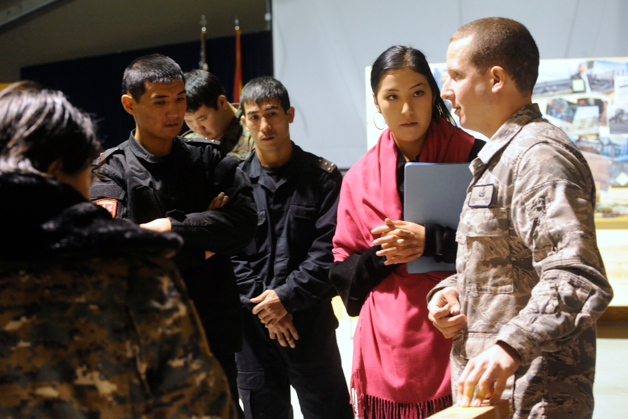 Tech. Sgt. Michael Chauncey explains the scenario for an explosive ordnance disposal and chemical, biological, radiological, nuclear and high-yield explosives response during an information exchange at the Transit Center at Manas, Kyrgyzstan, Nov. 22. Emergency responders from the Kyrgyz Ministries of Emergency Services, Interior and Defense participated in a joint EOD and CBRNE exercise here with their American counterparts. Chauncey is the 376th Expeditionary Civil Engineer Squadron EOD flight chief deployed from Joint Base Andrews, Md. (U.S. Air Force photo/Tech. Sgt. Tammie Moore)