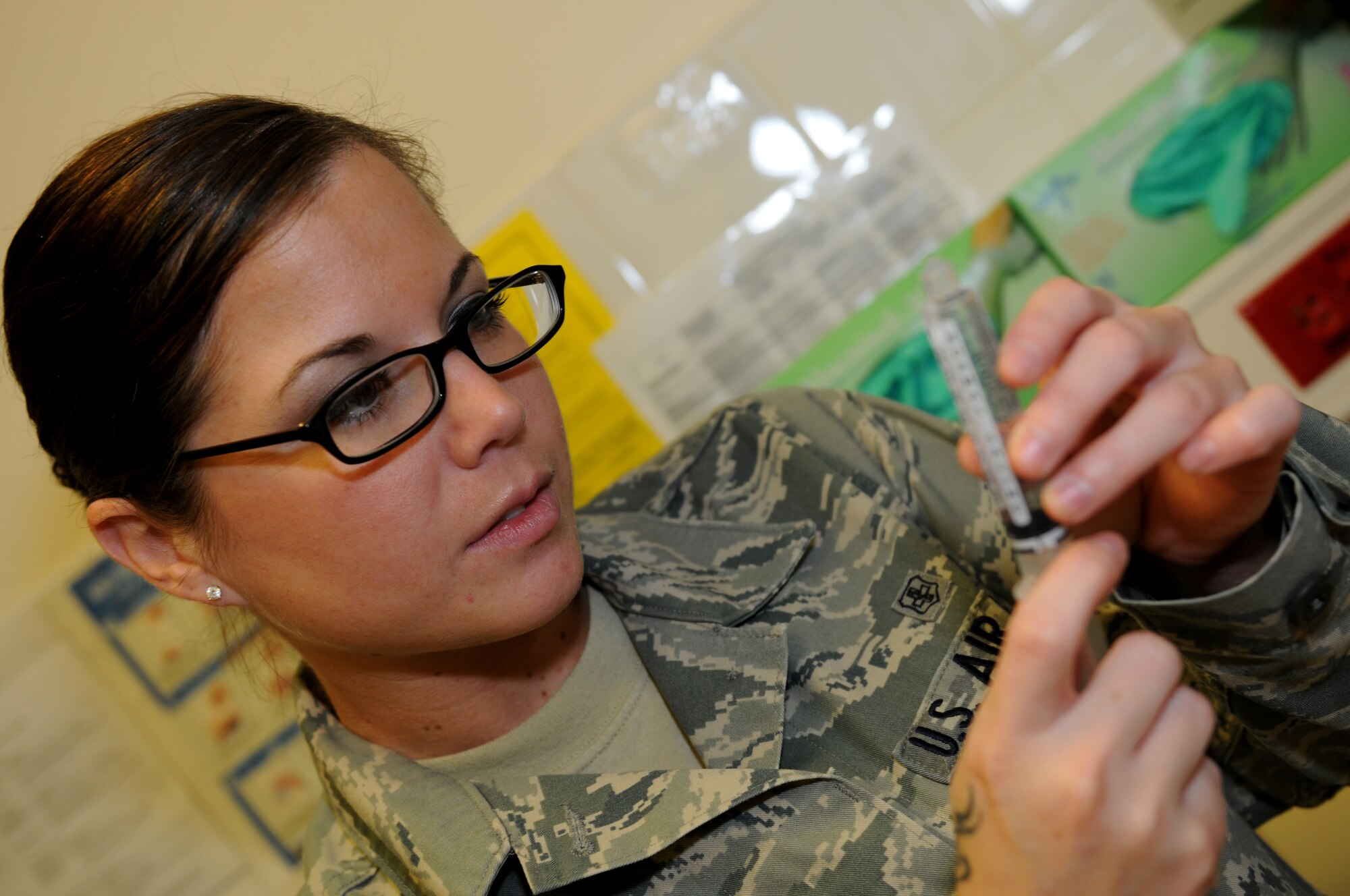 ROYAL AIR FORCE LAKENHEATH, England -- Senior Airman Krystle Clark, 48th In-Patient Care Squadron multiservice unit medical technician, readies an IV, Nov. 22, 2011. Clark was nominated for a Liberty Spotlight because she displays the core value of 'Excellence in All We Do'. (U.S. Air Force photo by Airman 1st Class Cory Payne)
