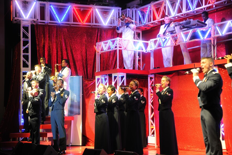 Members of Tops In Blue, the Air Force musical group, sing a patriotic montage for their finale during a concert at Kunsan Air Base, Republic of Korea, Nov. 22, 2011. Countries such as Taiwan, Bulgaria, Kosovo, Iceland, Thailand, Saudi Arabia, Afghanistan, Pakistan, Albania, Vietnam, Cuba, Africa and Iraq have all experienced the entertainment of Tops In Blue. (U.S. Air Force photo by Master Sgt. Sonny Cohrs/Released)