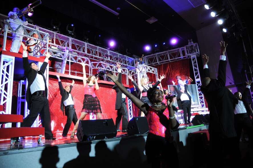 The Air Force musical group Tops In Blue performs for the crowd at Kunsan Air Base, Republic of Korea, Nov. 22, 2011. Under the guidance of five technical personnel, the performing team is responsible for setting up over 60,000 pounds of staging, lighting, audio, video and special effects equipment required for each performance.  (U.S. Air Force photo by Master Sgt. Sonny Cohrs/Released)