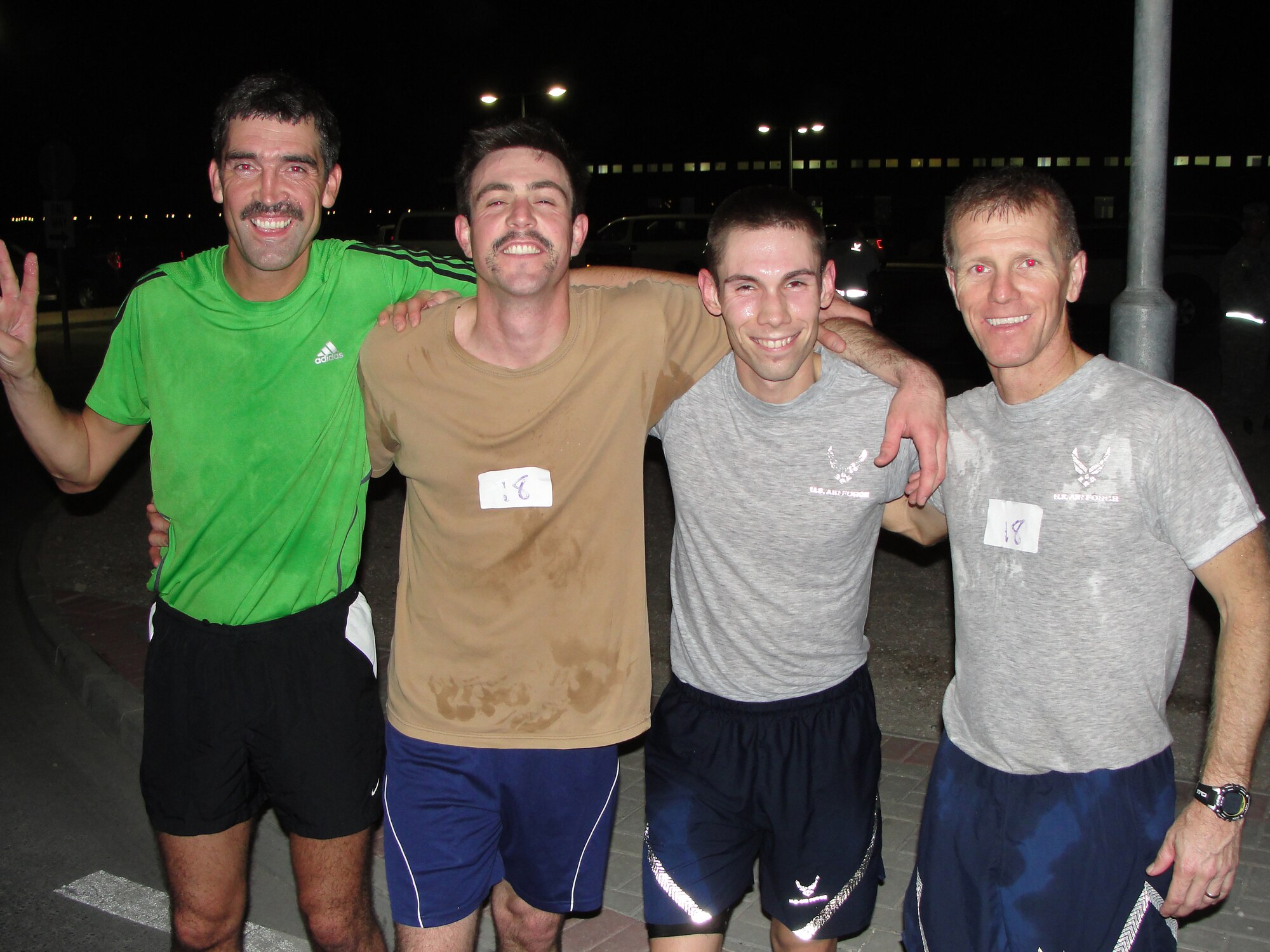 "Team International" won the Combined Federal Campaign-Overseas 10K Relay Nov. 16 at an undisclosed location in Southwest Asia. The team finished in a time of 33:54, averaging just under 5:30 per mile. Team members included (left to right): Royal Air Force Cpl. David Adam, 901st Expeditionary Air Wing, a native of Dundee, Scotland; Royal Australian Air Force Flight Lt. Andrew Shearer, RAAF Detachment, a native of Wodonga, Victoria;1st Lt. Ben Coffman, 379th Expeditionary Contracting Squadron, a native of Edwardsville, Kan., deployed from Whiteman Air Force Base, Mo.; and Tech. Sgt. Donnie Gray, 379th Expeditionary Communications Squadron, a native of Barbourville, Ky., deployed from Aviano Air Base, Italy. (Courtesy photo)