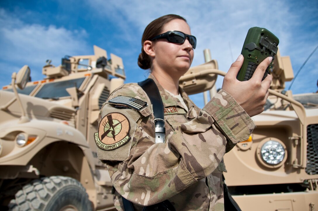 KANDAHAR AIRFIELD, Afghanistan -- Air Force Capt. Bryony Veater, Space Liaison Officer and Space Weapons Officer embedded with the 807th Expeditionary Air Support Operations Squadron, looks at a Defense Advanced GPS Receiver Nov. 23, 2011. Over the past six months, Veater has been training U.S. and coalition forces how to best utilize space into ground warfare.