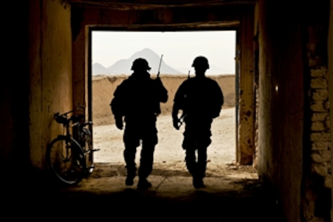 U.S. Army Staff Sgt. Mark Lynas, left, and Sgt. Mark Record secure a school and clear insurgent threats in a village in Shah Joy, Afghanistan, Nov. 22, 2011. Lynas, a squad leader, and Record, a team leader, are members of Provincial Reconstruction Team Zabul. Both sergeants are deployed from Company C, 182nd Infantry Regiment, Massachusetts National Guard.