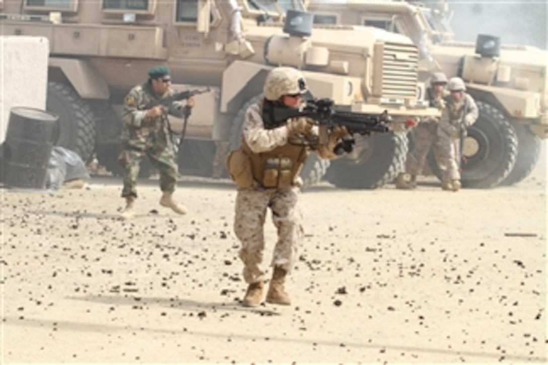 U.S. Marines and role-players react to scenario events at Marine Corps Training Area Bellows on Oct. 20, 2011, in preparation for the Infantry Immersion Trainer's grand opening ceremony on Oct 21, 2011.  The Infantry Immersion Trainer is separated into areas that will provide Enhanced Company Operations training opportunities to all military services.  