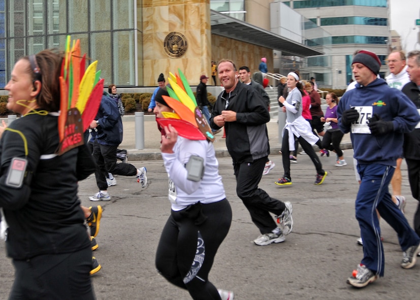 Members of the 914th and 107th Airlift Wings run with 12,500 others during the 116th annual YMCA Turkey Trot held this Thanksgiving morning November 24, 2011 Buffalo NY. Participants in the Turkey Trot have been known to wear unusual costumes during the race and this year was no exception. (U.S. Air Force photo by Staff Sgt. Joseph McKee)