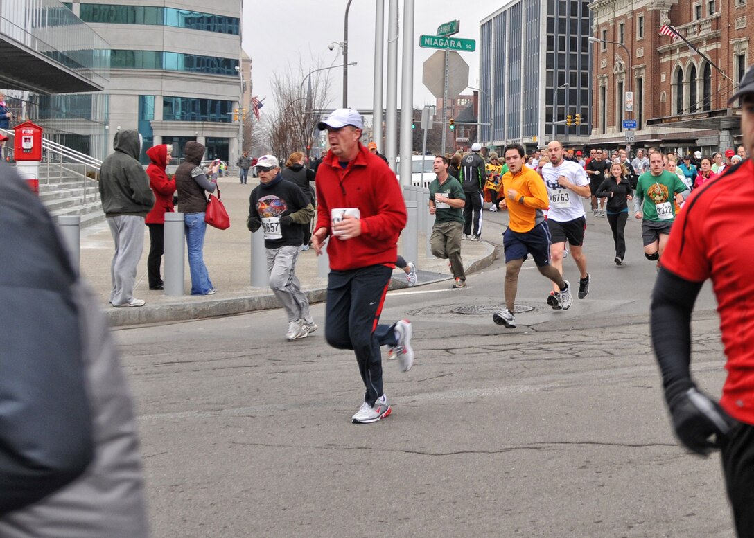 914th Airlift Wing Commander Col. Allan Swartzmiller (center) runs in the 116th annual YMCA Turkey Trot held Thanksgiving morning November 24, 2011 Buffalo NY. Established in 1896, this 8K race marked its 116th start on Thanksgiving morning, making it the oldest continually running footrace in North America. . (U.S. Air Force photo by Staff Sgt. Joseph McKee)