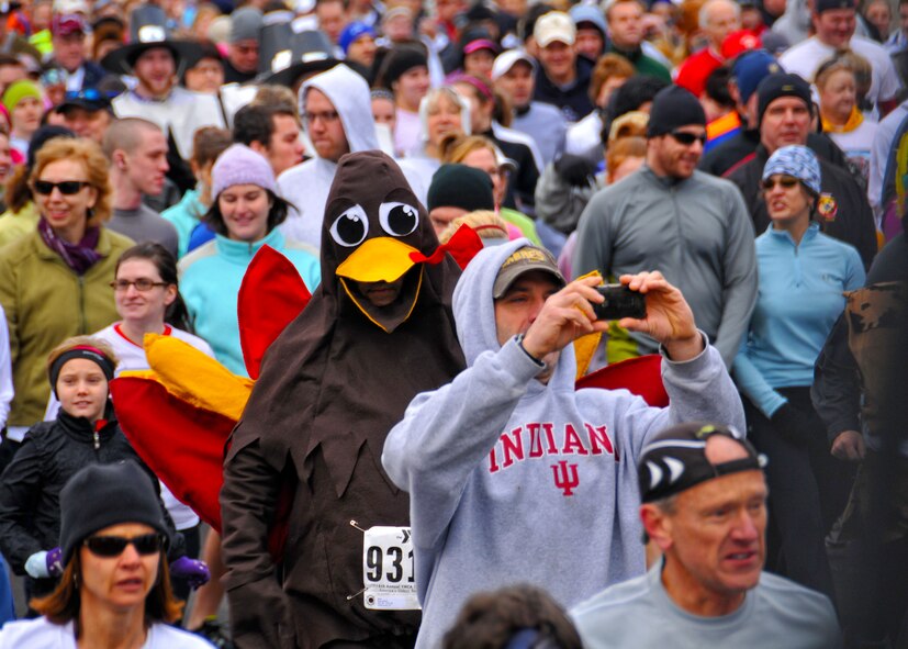 Members of the 914th and 107th Airlift Wings run with 12,500 others during the 116th annual YMCA Turkey Trot held this Thanksgiving morning November 24, 2011 Buffalo NY. Participants in the Turkey Trot have been known to wear unusual costumes during the race and this year was no exception. (U.S. Air Force photo by Staff Sgt. Joseph McKee)