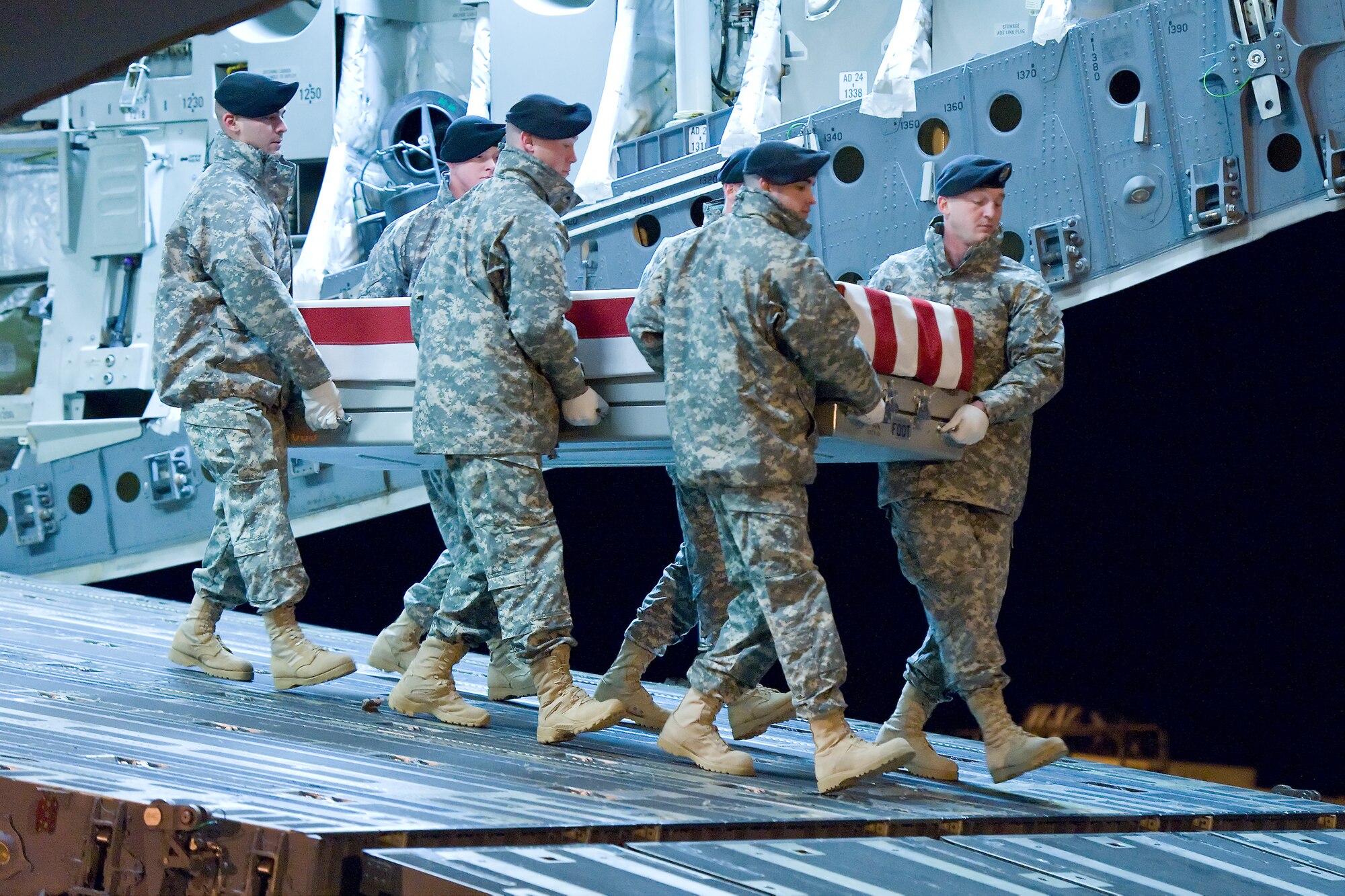 A U.S. Army carry team transfers the remains of Army Pvt. Jackie L. Diener II, of Boyne City, Mich., at Dover Air Force Base, Del., Nov. 24, 2011. Diener was assigned to the 3rd Squadron, 71st Cavalry Regiment, 3rd Brigade Combat Team, 10th Mountain Division, Ft. Drum, N.Y. (U.S. Air Force photo/Roland Balik)