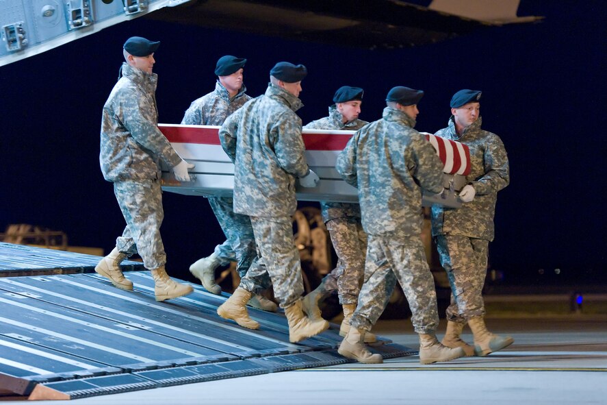 A U.S. Army carry team transfers the remains of Army Sgt. 1st Class Dennis R. Murray, of Red Boiling Springs, Tenn., at Dover Air Force Base, Del., Nov. 24, 2011. Murrary was assigned to the 2nd Battalion, 34th Armor Regiment, 1st Brigade Combat Team, 1st Infantry Division, Fort Riley, Kan.  (U.S. Air Force photo/Roland Balik)