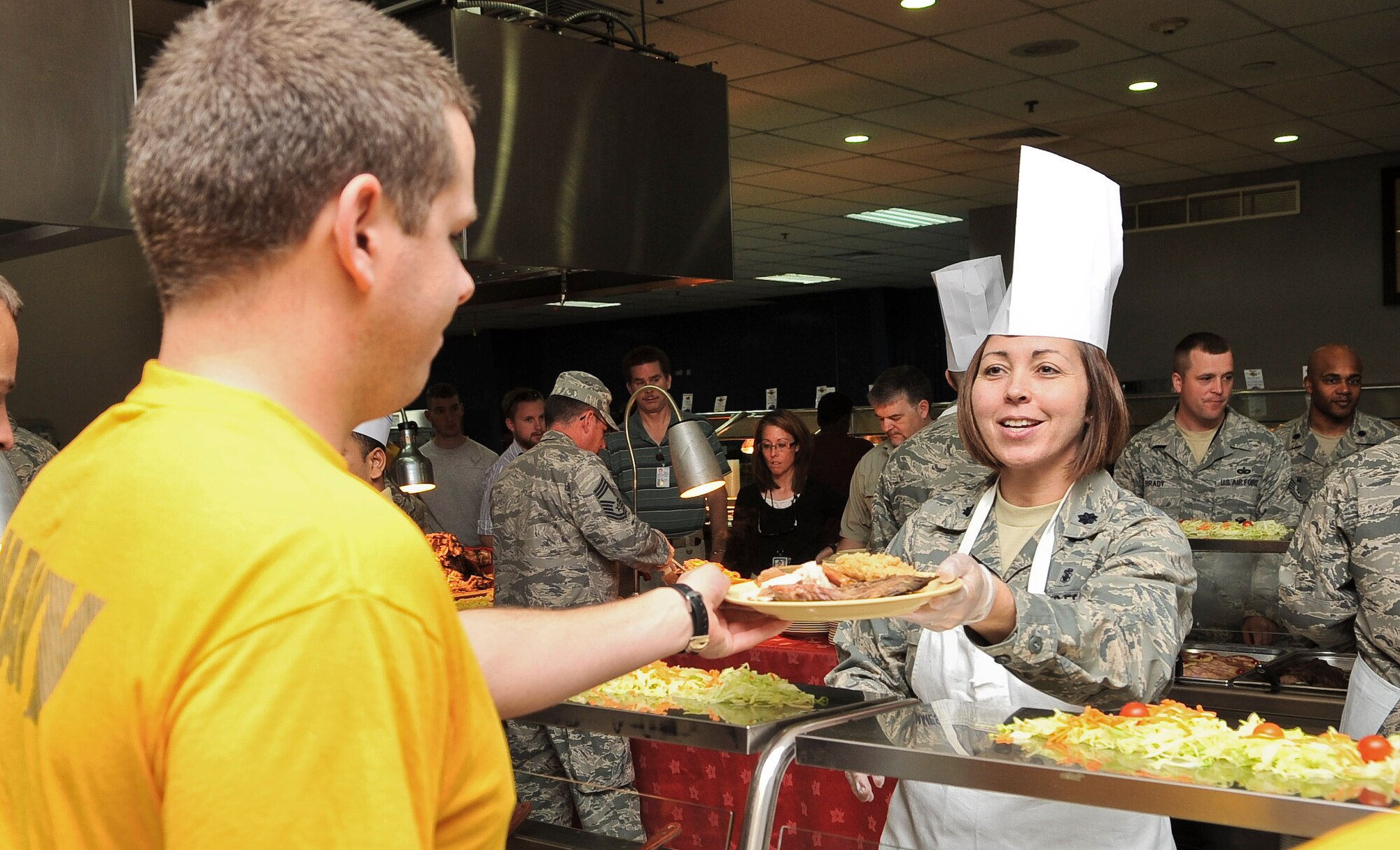 Lt. Col Dana James, 379th Expeditionary Medical Group deputy commander, serves  a Sailor a Thanksgiving dinner of roast beef, turkey and stuffing Nov. 24, 2011, at an undisclosed location in Southwest Asia. (U.S. Air Force photo/Senior Airman Paul Labbe)
