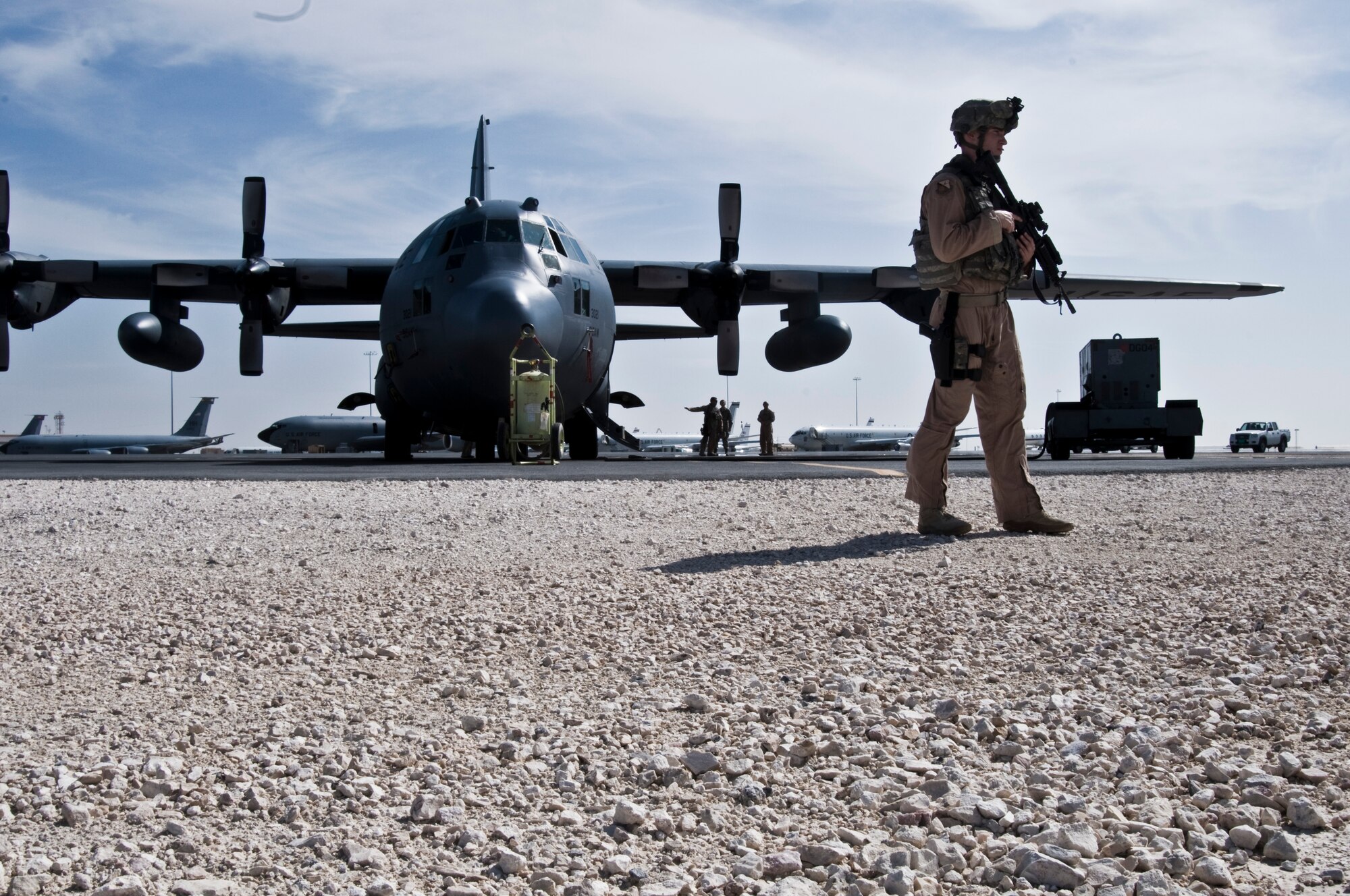 Airman 1st Class David McCune, 379th Expeditionary Security Forces Squadron Fly Away Security Team member, assumes a defensive posture while training to provide security for a C-130 Hercules Nov. 17, 2011, at an undisclosed location in Southwest Asia. The FAST mission is to travel with aircraft and provide security at locations around the area of responsibility that the Department of Defense has deemed to be unsecure. McCune, a native of Anchorage, Alaska, is deployed from Hill Air Force Base, Utah. (U.S. Air Force photo/Senior Airman Eric Summers Jr.) 