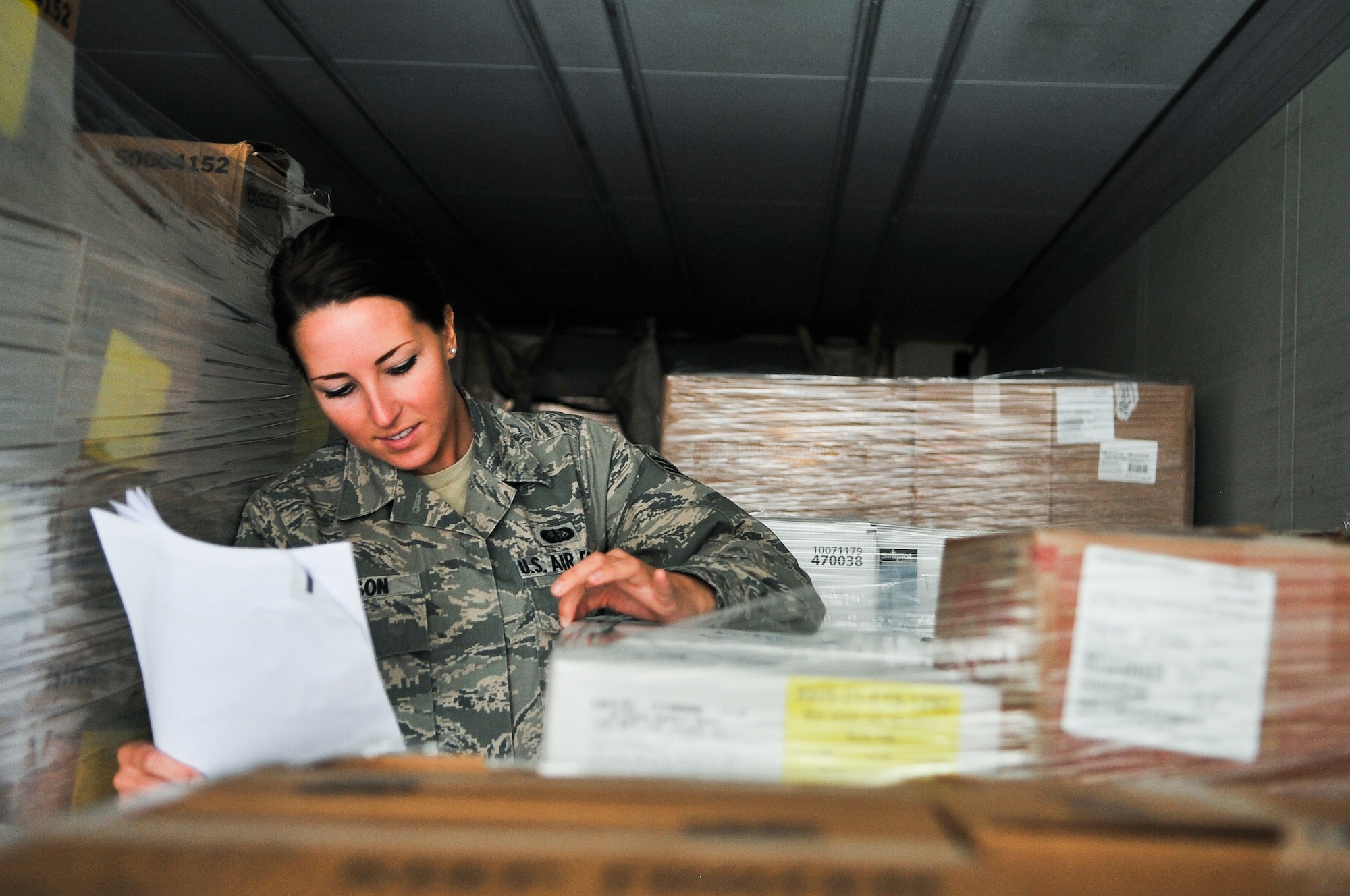 Senior Airman Jessica Nelson, 379th Expeditionary Force Support Squadron quality assurance evaluator, compares her inventory list of Thanksgiving Day food to items received Nov. 11, 2011, at an undisclosed location in Southwest Asia. Nelson, a native of Madison, Wis., is deployed from Truax Field in Madison. (U.S. Air Force photo/Senior Airman Paul Labbe)
