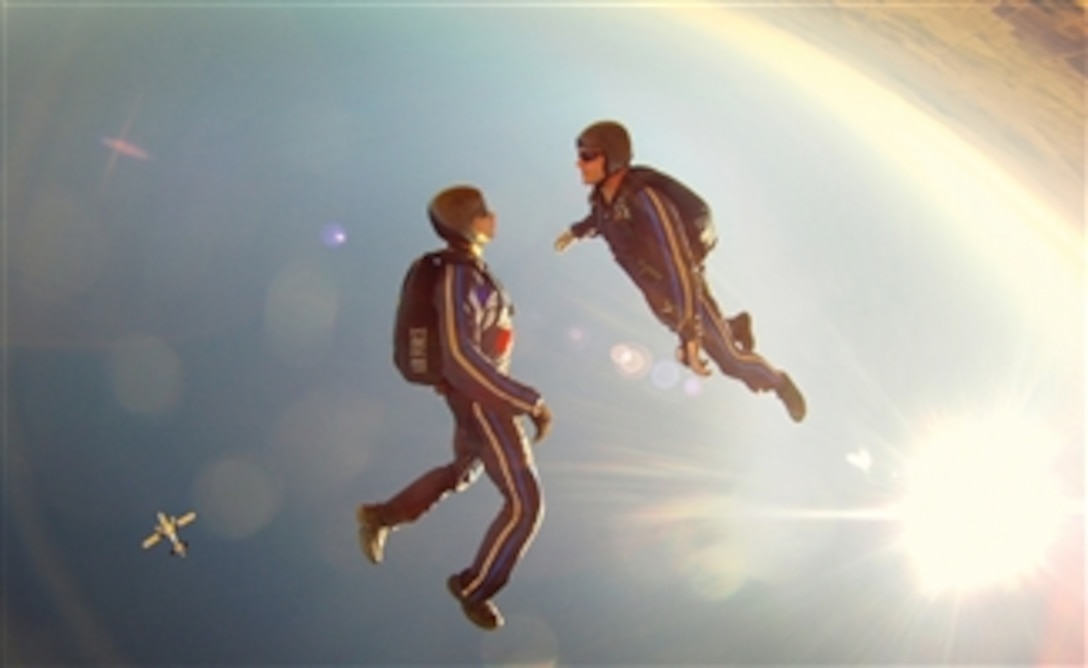 U.S. Air Force Academy cadets with the Air Force Wings of Blue Parachute Competition Team perform at the U.S. Parachuting Association's national championships in Eloy, Ariz., on Nov. 3, 2011.  The "Air Force Intrepid" competition team took first place in the four-person intermediate free-flying event.  