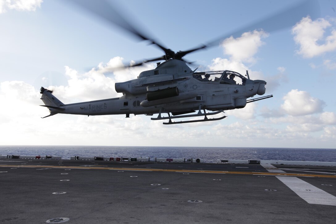 Majs. Travis Patterson and Don McGuire, AH-1Z Super Cobra pilots, land on USS Makin Island here Nov. 14. The Marines serve with Marine Medium Helicopter Squadron 268 (Reinforced), the aviation combat element for the 11th Marine Expeditionary Unit, which embarked USS Makin Island, USS New Orleans and USS Pearl Harbor in San Diego Nov. 14, beginning a seven-month deployment to the Western Pacific and Middle East regions.