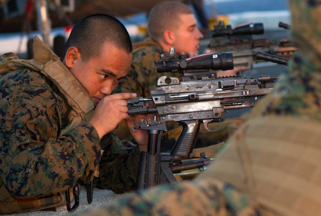 Lance Cpl. Thien Le reassembles a machine gun on the flight deck of the amphibious transport dock New Orleans here Nov. 25 during weapon drills with the 11th Marine Expeditionary Unit. Thien is a 19-year-old Houston native and a machine gunner with Company L. The Pendleton-based company is one of three rifle companies with Battalion Landing Team 3/1, the ground combat element for the unit, which embarked USS Makin Island, USS New Orleans and USS Pearl Harbor in San Diego Nov. 14, beginning a seven-month deployment through the Western Pacific and Middle East regions.