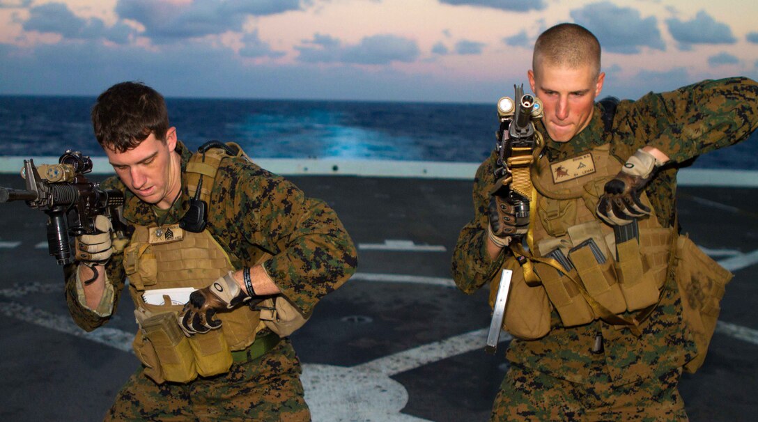Squad leader Sgt. Cyle Nickerson and rifleman Lance Cpl. Nathan S. Zoon practice reloading their rifles on the flight deck of the amphibious transport dock New Orleans here Nov. 25 during weapon drills with the 11th Marine Expeditionary Unit. Nickerson is a 26-year-old Onalaska, Wis., native and Zoon is a 20-year-old Baker City, Ore., native, both serve with Company L. The Pendleton-based company is one of three rifle companies with Battalion Landing Team 3/1, the ground combat element for the unit, which embarked USS Makin Island, USS New Orleans and USS Pearl Harbor in San Diego Nov. 14, beginning a seven-month deployment through the Western Pacific and Middle East regions.