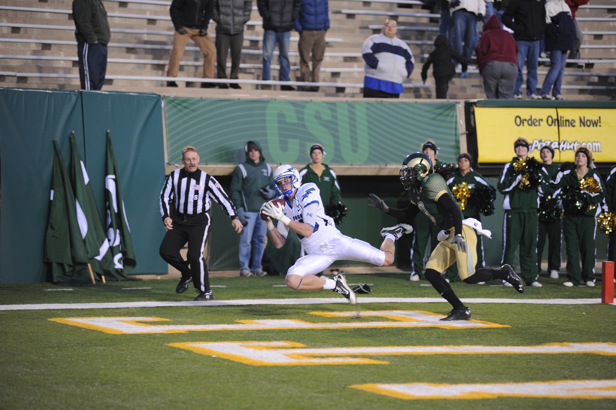 Wide receiver Zach Kauth pulls in his first touchdown of the night, while falling in the end zone, to put the Falcons up 14-7.  Kauth caught only three passes during the game, but those passes totalled 123 yards and three touchdowns, as the Falcons beat CSU 45-21. (U.S. Air Force Photo/ John Van Winkle) 