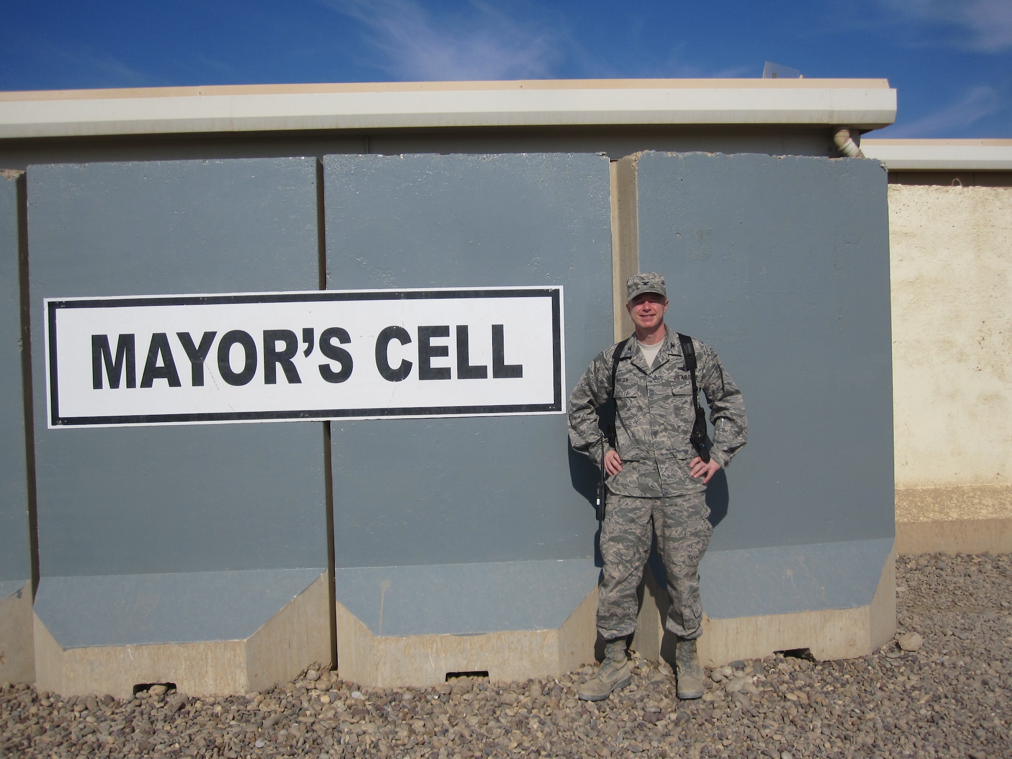 Col. Brent Bigger, 332nd Expeditionary Mission Support Group commander, who arrived at JBB four months prior to the transition, takes time for one last photo at Joint Base Balad, Iraq, Nov. 5, 2011. Bigger, who is deployed from the Pentagon, was one of the last Air Force officials at JBB and was present to witness the official tranisition ceremony. (Coutesy photo)