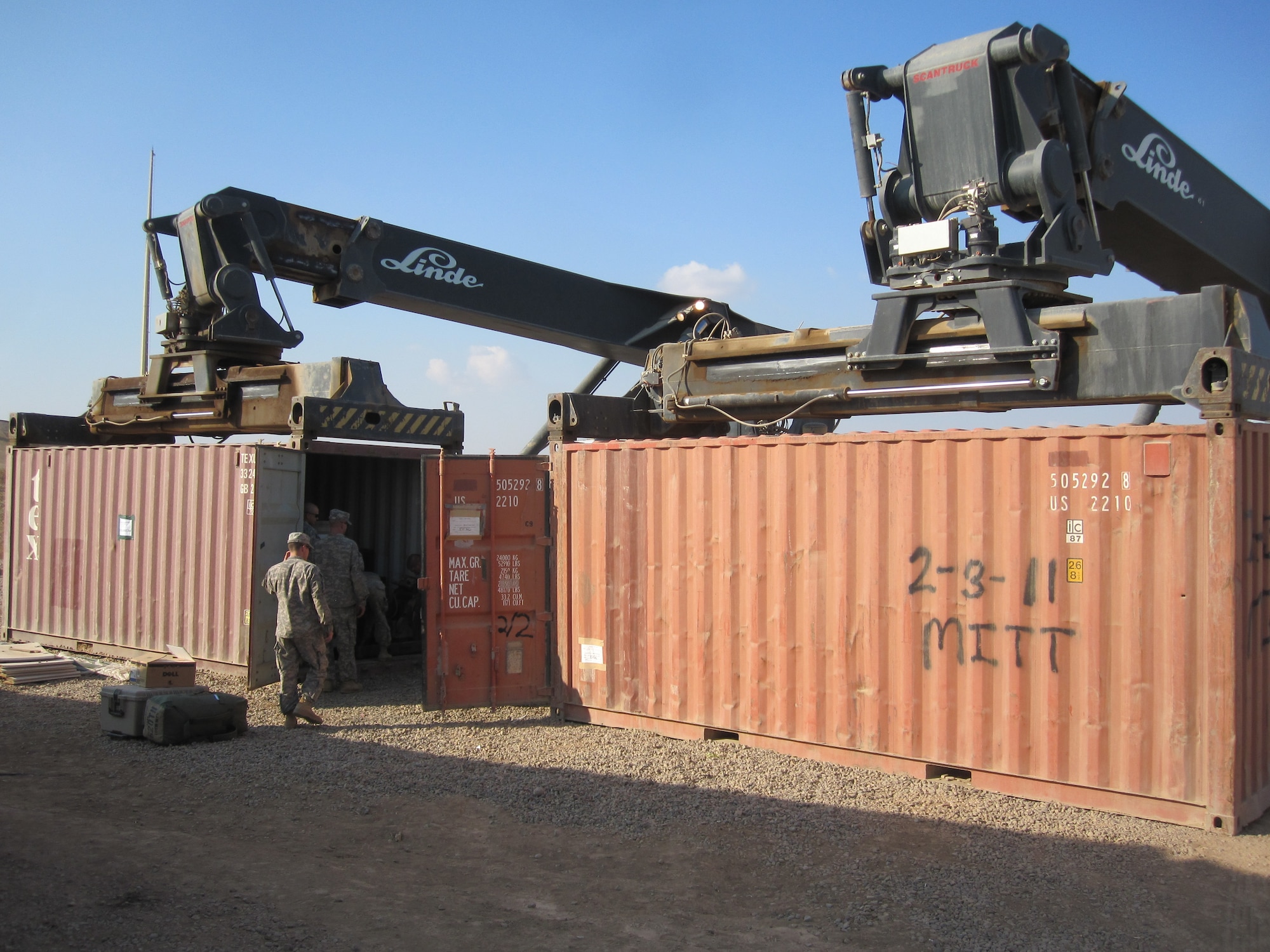 Airmen from the 332nd Air Expeditionary Wing pack one of the last conex boxes at Joint Base Balad, Iraq, just prior to the transition from U.S. forces to the Government of Iraq Nov. 5, 2011. Because JBB housed thousands of coalition forces during Operation Iraqi Freedom  and Operation New Dawn, moving personnel and material required the cooperation of all assigned personnel, along with thousands of conex boxes. (Coutesy photo)
