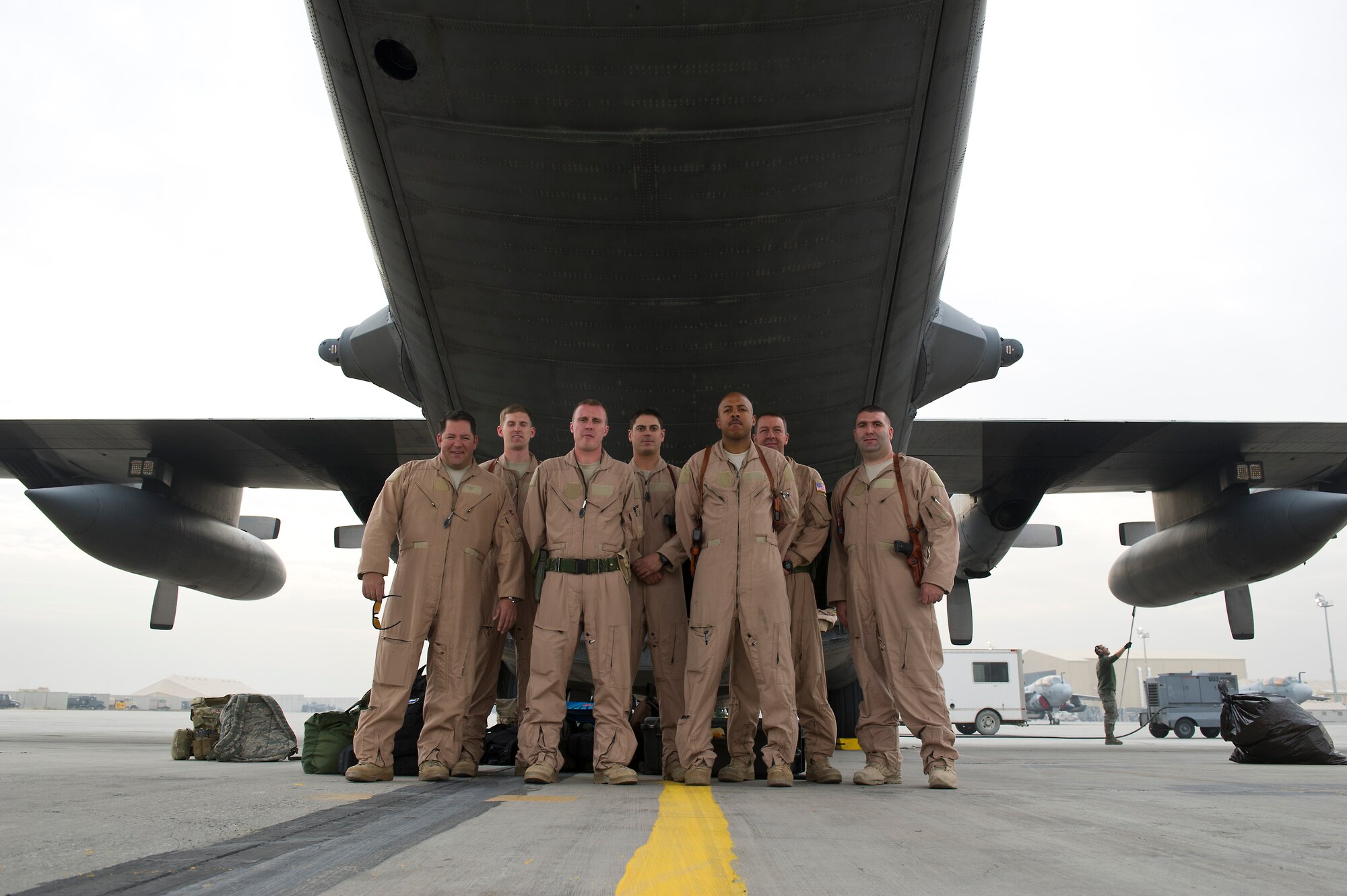 The crew of a U.S. Air Force C-130, (left to right) Maj. Jonathan Locklear, 1st Lt. Blake Short, 1st Lt. Steven Williams, Staff Sgt. Steve Morris, Staff Sgt. Ranon Barber, Chief Master Sgt. Andrew Huneycutt and Staff Sgt. Michael Crystal, pose for a photo at Bagram Air Field, Afghanistan, after completing two airdrop missions on Nov. 23, 2011. The crew airdropped a 12,000 pound forklift and 14 bundles of food and supplies to Soldiers in remote areas of Afghanistan. The crew is assigned to the 774th Expeditionary Airlift Squadron and is deployed from the 145th Air Wing, Air National Guard, Charlotte, N.C. (U.S. Air Force photo/Master Sgt. Jeffrey Allen)