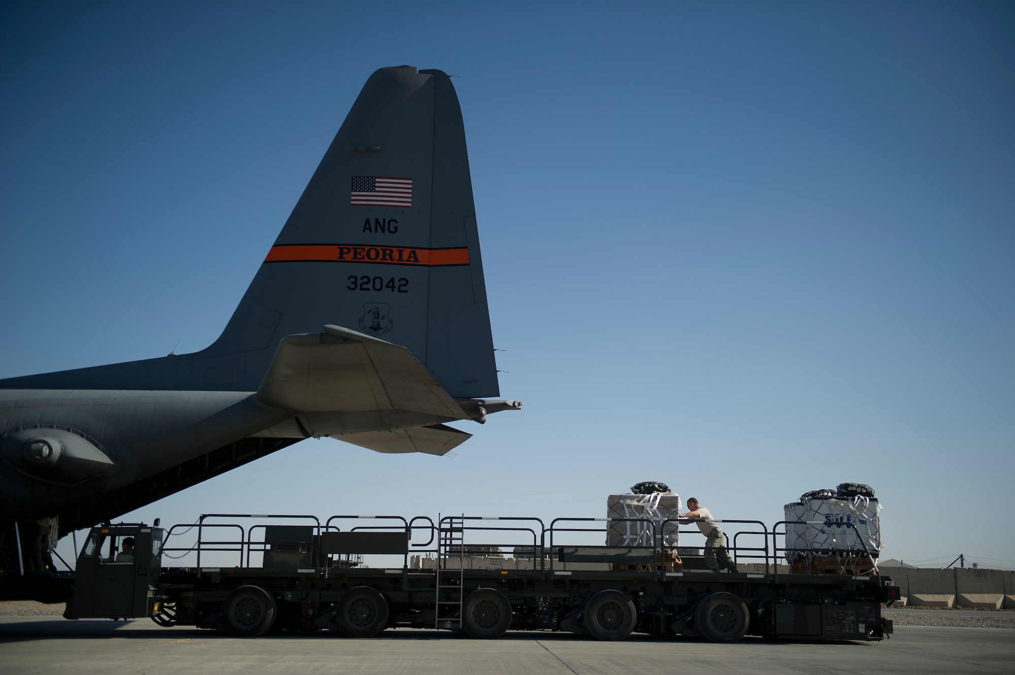 A U.S Air Force C-130 Hercules is loaded with bundles of food and supplies at Kandahar, Afghanistan, on Nov., 23, 2011. The C-130, flown by a crew from the 774th Expeditionary Airlift Squadron, will airdrop the bundles to Soldiers at a remote base in eastern Afghanistan. (U.S. Air Force photo/Master Sgt. Jeffrey Allen)
