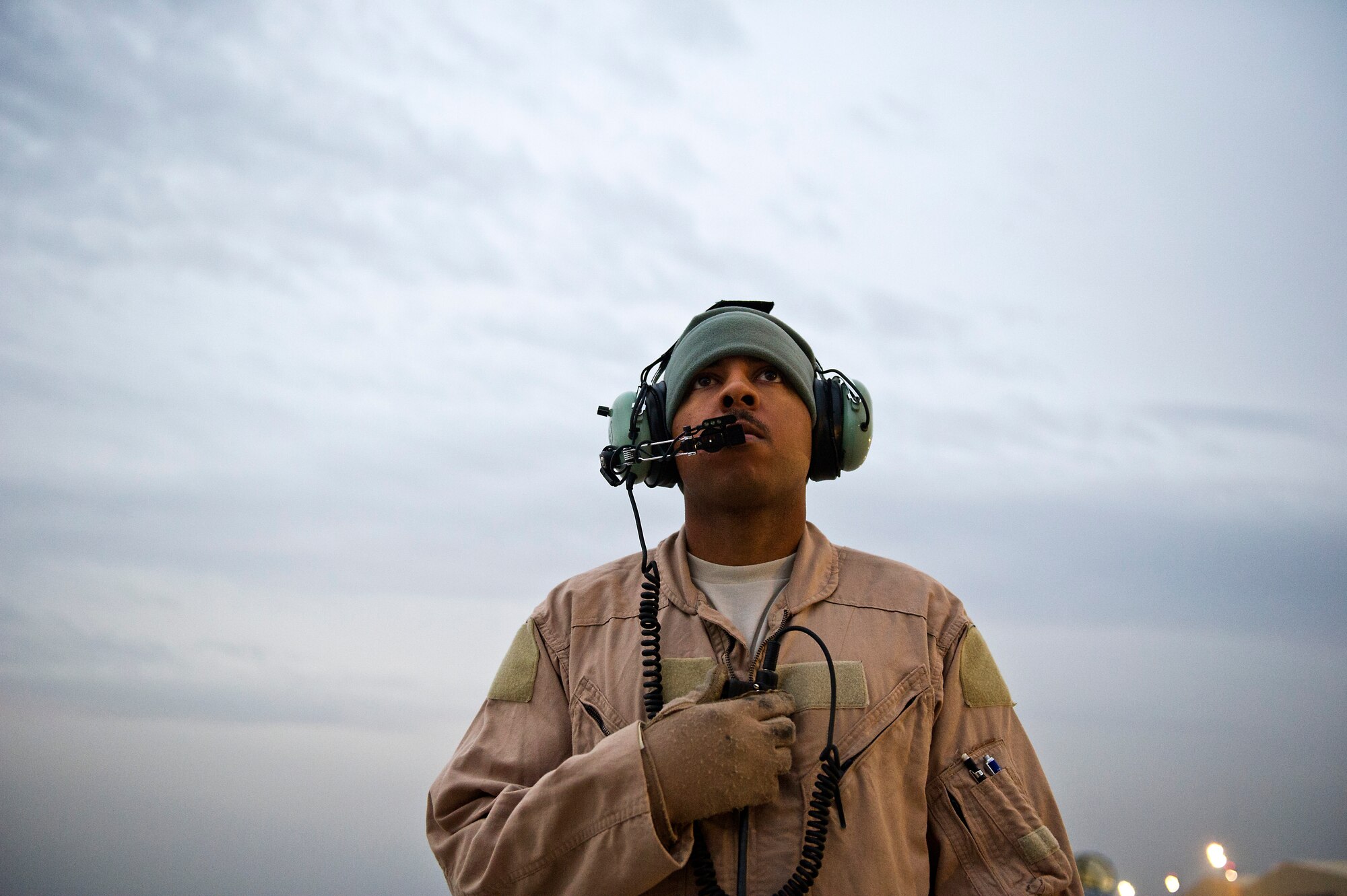 Staff Sgt. Ranon Barber, 774th Expeditionary Airlift Squadron, watches for malfunctions while pilots start the engines of U.S. Air Force C-130 Hercules at Bagram Air Field, Afghanistan, on Nov. 23, 2011. Barber is deployed to Afghanistan from the 145th Air Wing, Air National Guard, Charlotte, N.C.(U.S. Air Force photo/Master Sgt. Jeffrey Allen)