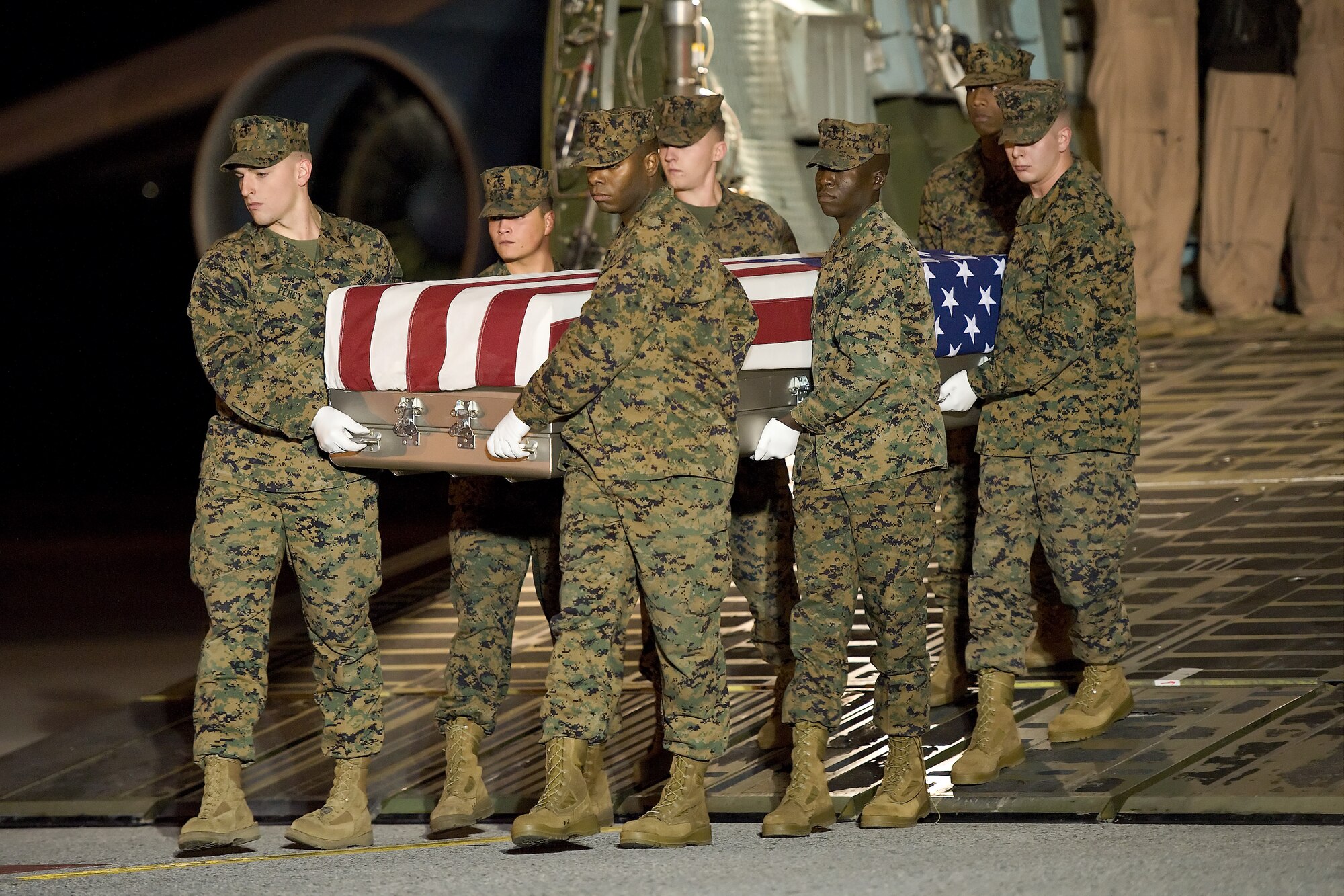 A U.S. Marine Corps carry team transfers the remains of Marine Cpl. Zachary C. Reiff, of Preston, Iowa, at Dover Air Force Base, Del., Nov. 25, 2011. Reiff was assigned to 3rd Battalion, 7th Marine Regiment, 1st Marine Division, I Marine Expeditionary Force, Twentynine Palms, Calif. (U.S. Air Force photo/Roland Balik)