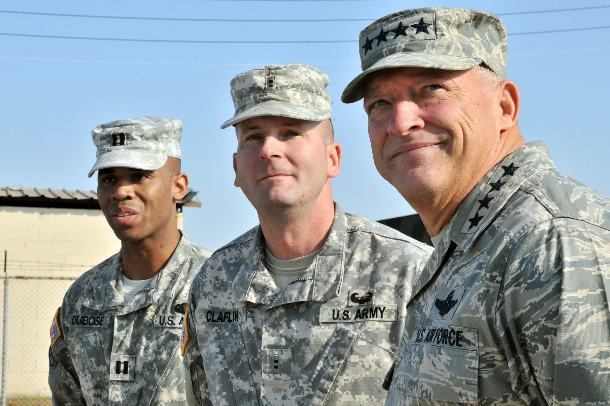 Army Capt. Anthony Dubose, Alpha Battery 2-1 Air Defense Artillery commander, and Chief Warrant Officer 2 Joe Claflin, battery trainer and maintenance officer, speak with Gen. Gary North, Pacific Air Forces commander, during his tour of Kunsan Air Base, Republic of Korea, Nov. 21. Soldiers from the 1st Battalion, 43rd Air Defense Artillery briefed the general on their mission here at the Wolf Pack. (U.S. Air Force photo by Senior Airman Brittany Y. Auld/Released)