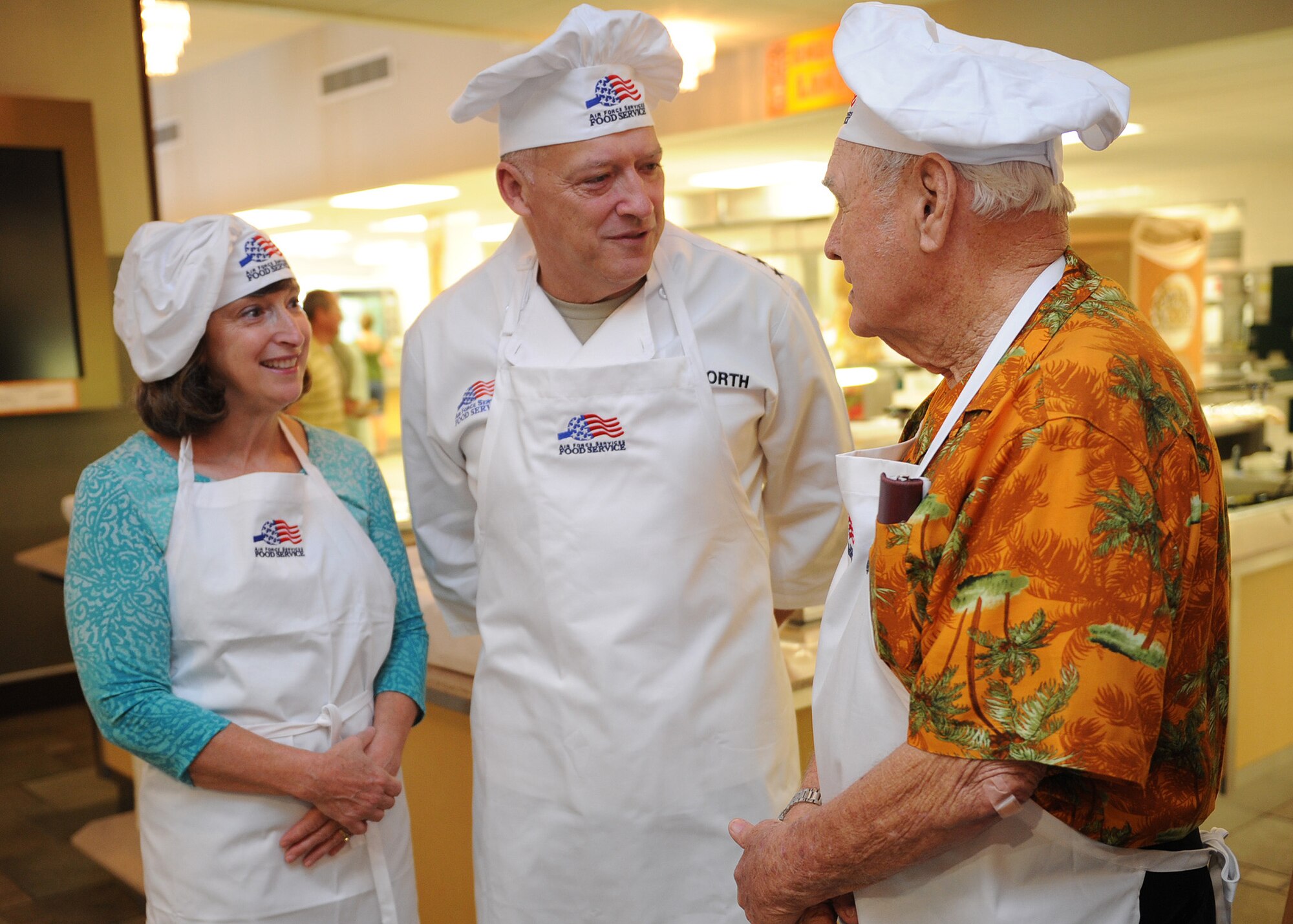 Mrs. Shelley North and Gen. Gary North, Pacific Air Forces commander, meets with Mr. Duward Swanson, a Hickam Field survivor before they serve and eat Thanksgiving Day meals with Hickam Airmen, at the Hale Aina Dining Facility at Joint Base Pearl Harbor-Hickam, Hawaii, Nov. 24. Gen. North and PACAF senior leaders, Air Force Civilian Advisory Council and Friends of Hickam, where all on hand to help serve and celebrate Thanksgiving Day with Airmen and their family and friends. (U.S. Air Force photo/Tech. Sgt. Jerome S. Tayborn/Released)