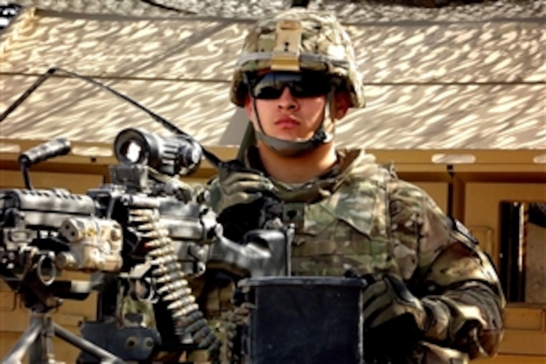 U.S. Army Spc. Ricardo Gonzalez spends pulls security on Thanksgiving Day at an entry control point on Forward Operating Base Lindsey, Afghanistan, Nov. 24, 2011. Gonzalez is assigned to the 25th Infantry Division's 2nd Battalion, 8th Field Artillery Regiment, 1st Stryker Brigade Combat Team.