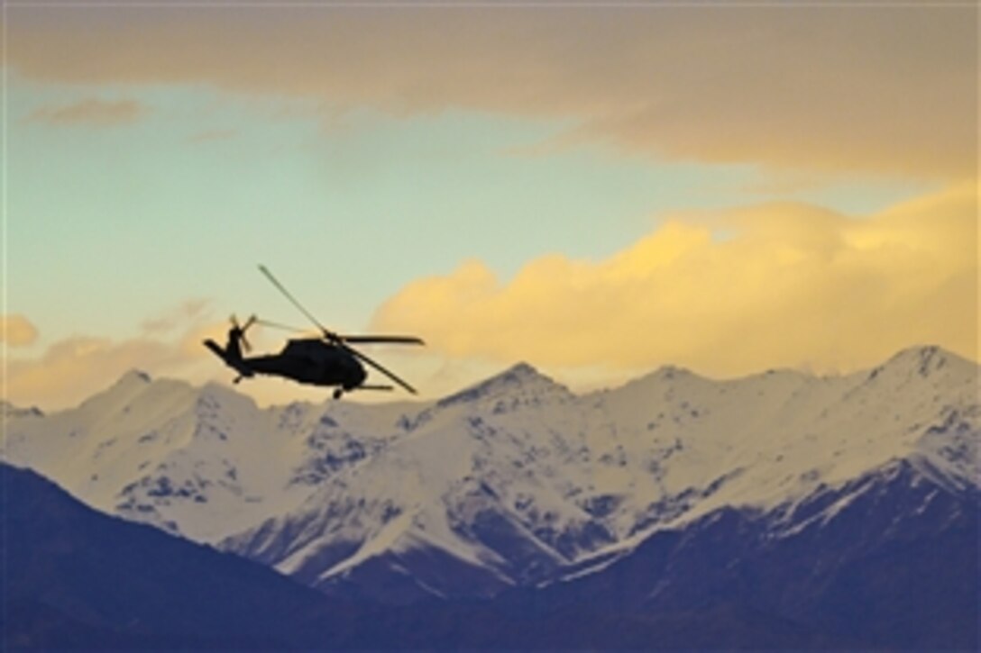 U.S. Air Force personnel aboard a HH-60 Pave Hawk helicopter take off from Bagram Airfield, Afghanistan, Nov. 19, 2011. The airmen are assigned to the 83rd Expeditionary Rescue Squadron.