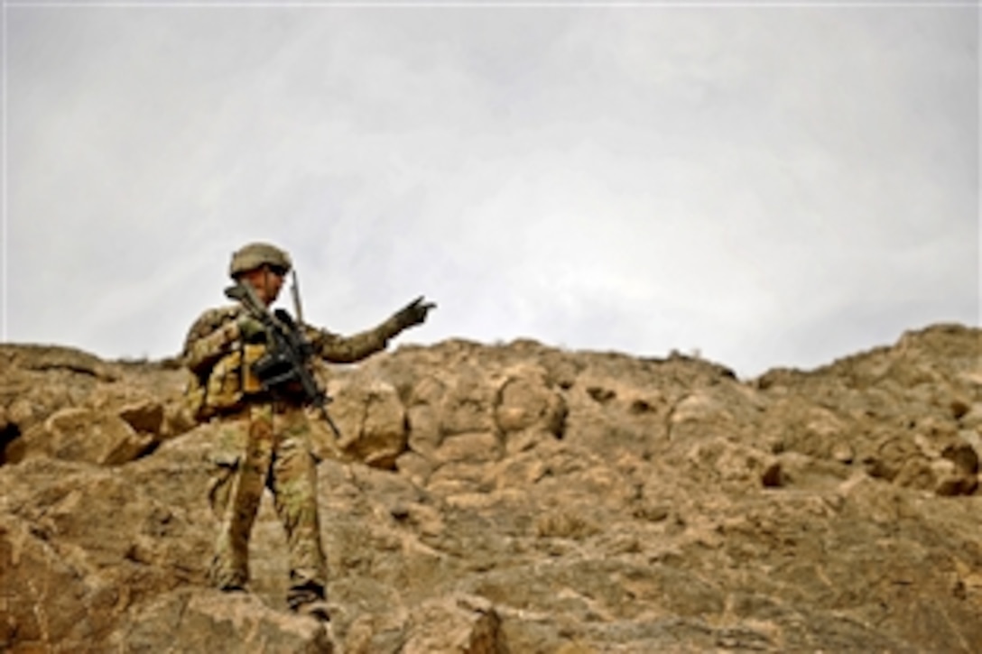 U.S. Army Sgt. Mark Record secures an area to ensure it is free of insurgent threats in Shah Joy, Afghanistan, Nov. 22, 2011. Record is assigned to Company C, 182nd Infantry Regiment, working as a team leader on Provincial Reconstruction Team Zabul.