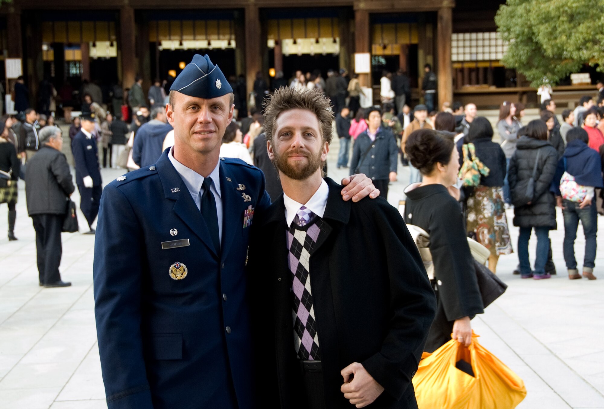 TOKYO, Japan -- Lt. Col. Wade Rawlins, 374th Civil Engineer Squadron commander at Yokota Air Base, Japan, and Justin Barbettini, 374th CES, pose for a photo at the Meiji Shrine in Tokyo, Japan, Nov. 26, 2011. The Good Deed Association is a non-profit organization under the management of the Cabinet Office of the Government of Japan. The association is committed to encouraging good conduct and enhancing mutual relationships among the members of the community. (U.S. Air Force photo/Airman 1st Class Krystal M. Garrett)  