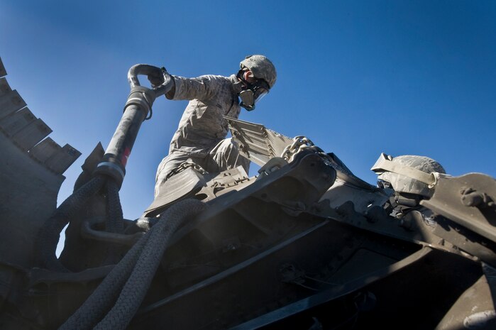 U.S. Air Force Staff Sgt. Ian Zerby, 820th RED HORSE Squadron airborne flight member, prepares to rig a connex box for a sling-load during a peacetime operation Nov. 9, 2011, in the Nevada Test and Training Range. The sling load training and air assault certification of 820th RHS airborne flight Airmen proved crucial in the success of the quick-response operation. (U.S. Air Force photo by Airman 1st Class Daniel Hughes/Released)