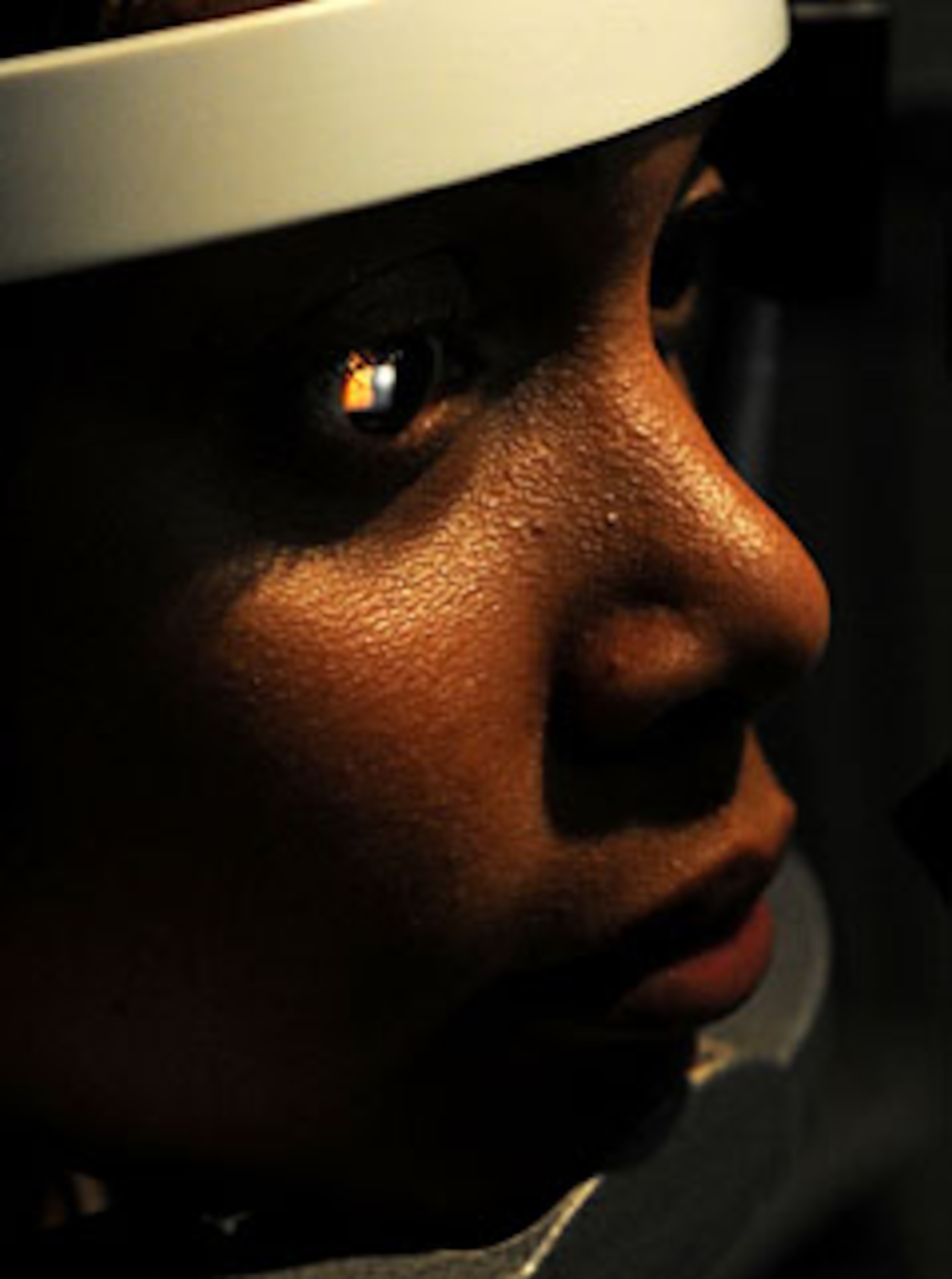 U.S. Air Force Staff Sgt. Suzette Skrecz, 18th Medical Support Squadron medical readiness technician, looks straight forward into a slit lamp so U.S. Air Force Tech. Sgt. Jeremy Jackson, 18th Aeromedical Squadron ophthalmic specialist, can look inside her eye during a checkup at the optometry clinic on Kadena Air Base, Japan, Oct. 13, 2011. When you go to the optometry clinic they administer several tests to make sure you are fit to fight. (U.S. Air Force photo by Airman 1st Class Brooke P. Beers/Released)