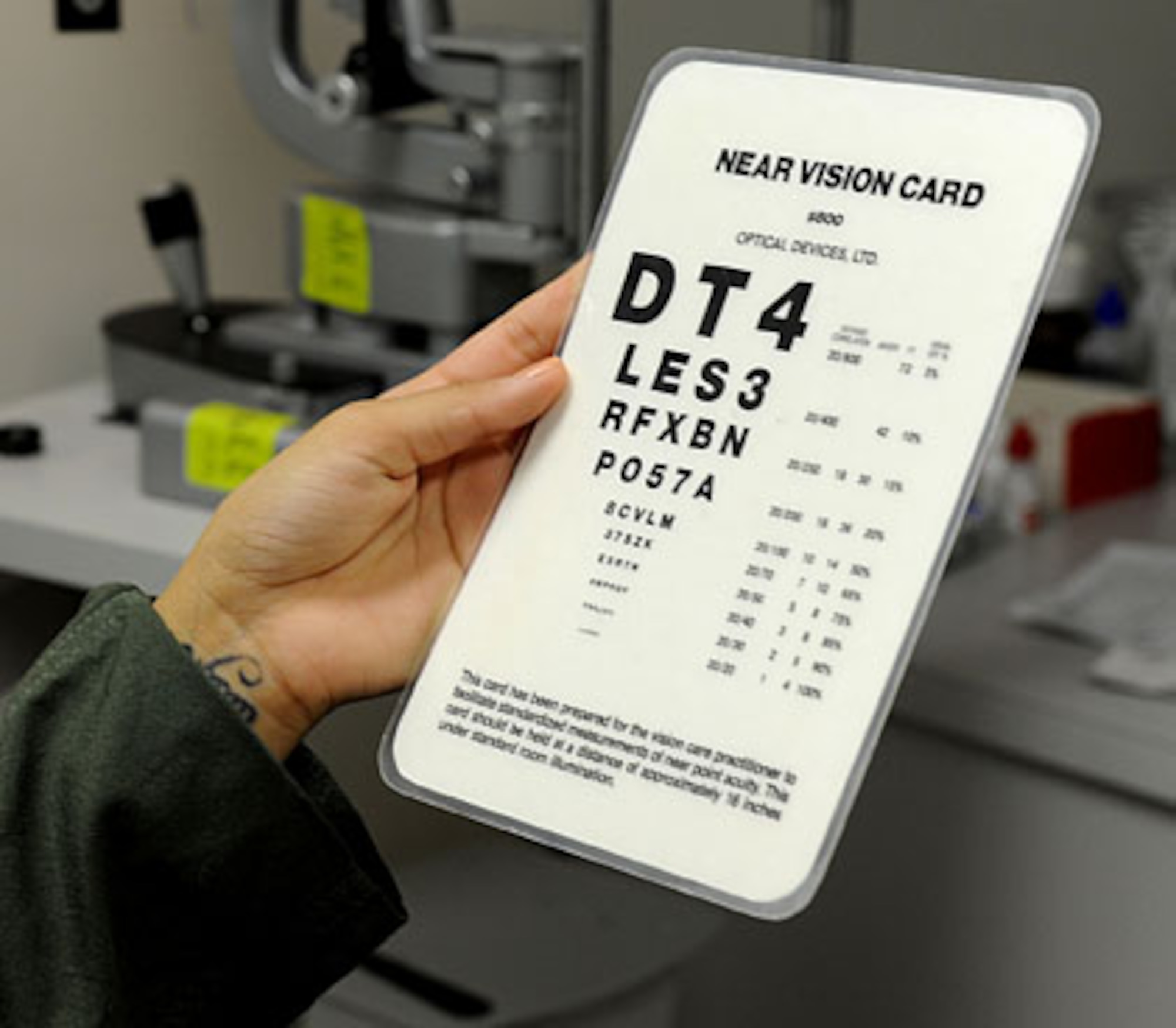 U.S. Air Force Senior Airman Christie Chatham, 961st Airborne Air Control Squadron member, checks her vision with a near vision card during her appointment at the 18th Medical Group optometry clinic on Kadena Air Base, Japan, Oct. 12, 2011. Service members on flying status must maintain regular eye checkups to ensure the safety of the crew and the readiness of the force. (U.S. Air Force photo by Airman 1st Class Brooke P. Beers/Released)