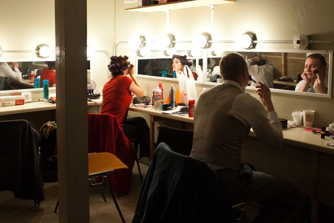 It takes a great deal of time preparing before a show begins, such as vocal warmups, costumes, and make-up. (U.S. Air Force photo by Airman Alystria Maurer/Released)