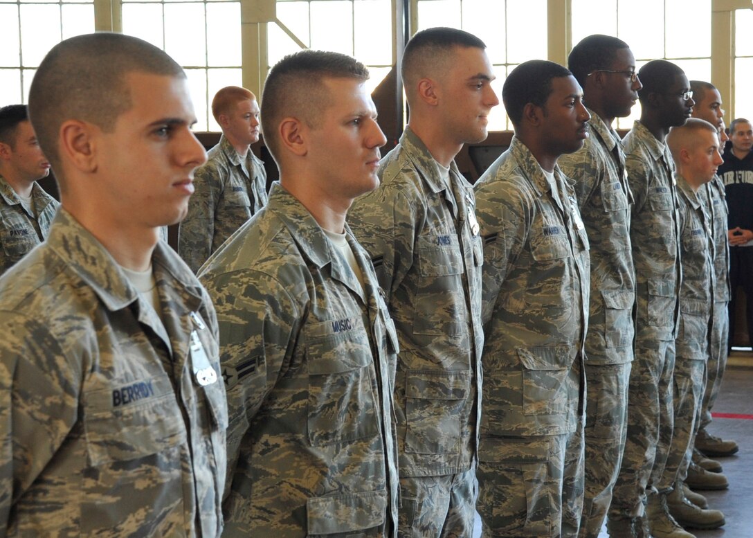 Airmen stand at attention as they prepare to graduate from the 364th Training Squadron Electrical and Environmental Apprentice course Nov. 23, 2011 at Sheppard Air Force Base, Texas. Students learn every aspect of the aircraft’s electrical system and environmental system over 11 blocks of instruction during 91 academic days and 17 weeks total of training.