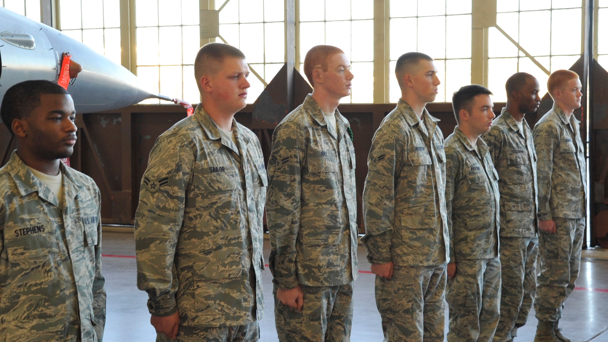 Airmen stand at attention as they prepare to graduate from the 364th Training Squadron Electrical and Environmental Apprentice course Nov. 23, 2011 at Sheppard Air Force Base, Texas. Students learn every aspect of the aircraft’s electrical system and environmental system over 11 blocks of instruction during 91 academic days and 17 weeks total of training.
