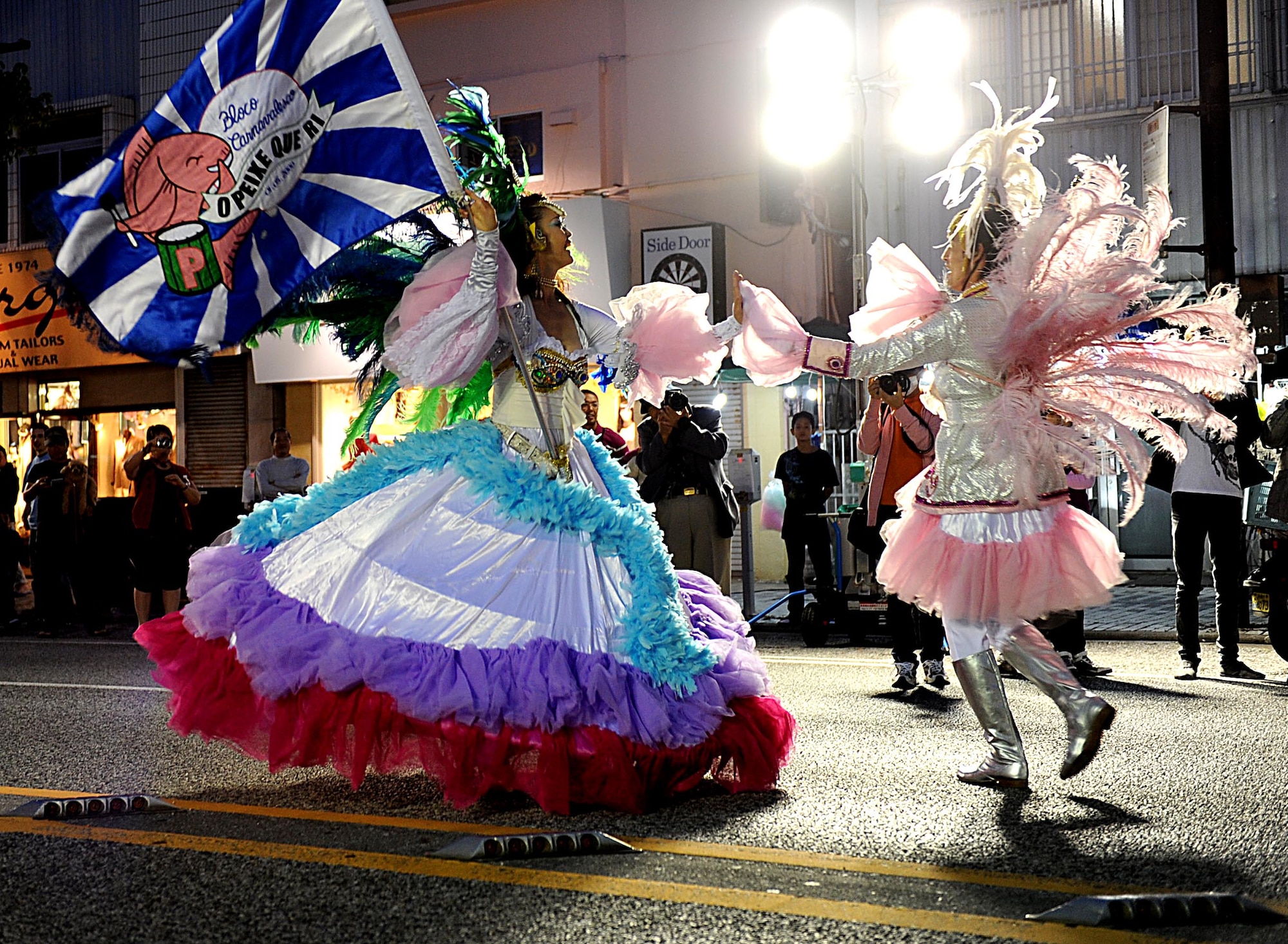 Okinawans dressed as a king and queen dance during a parade during the Okinawan International Carnival, Nov. 28, 2011. The carnival included a parade, local food and a giant tug-of-war competition. (U.S. Air Force photo by Airman 1st Class Brooke P. Beers/Released)