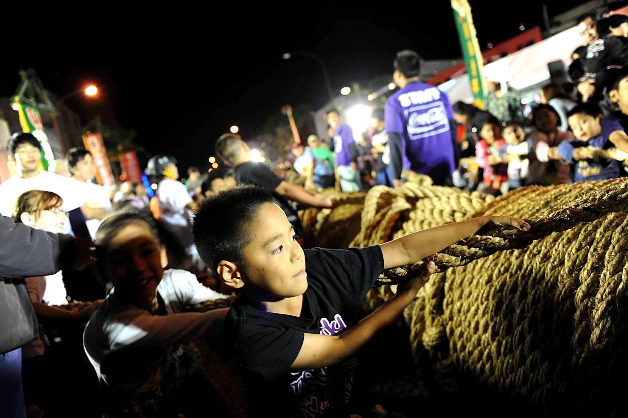 Children participate in their own tug-of-war competition during the Okinawa International Carnival, Nov. 28, 2011. The carnival is for both Americans and Okinawans to come together and celebrate their friendship.  (U.S. Air Force photo by Airman 1st Class Brooke P. Beers/Released)
