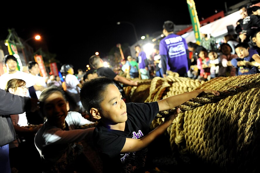 Children participate in their own tug-of-war competition during the Okinawa International Carnival, Nov. 28. The carnival is for both Americans and Okinawans to come together and celebrate their friendship. (U.S. Air Force photo by Airman 1st Class Brooke P. Beers/Released) 


