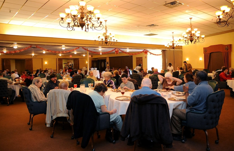 Team Barksdale families enjoy a Thanksgiving meal at the Consolidated Club on Barksdale Air Force Base, La., Nov. 24. The meal was served by base first sergeants and wing leadership and included turkey, ham, several side dishes and numerous desserts. (U.S. Air Force photo/Senior Airman Amber Ashcraft)(RELEASED)