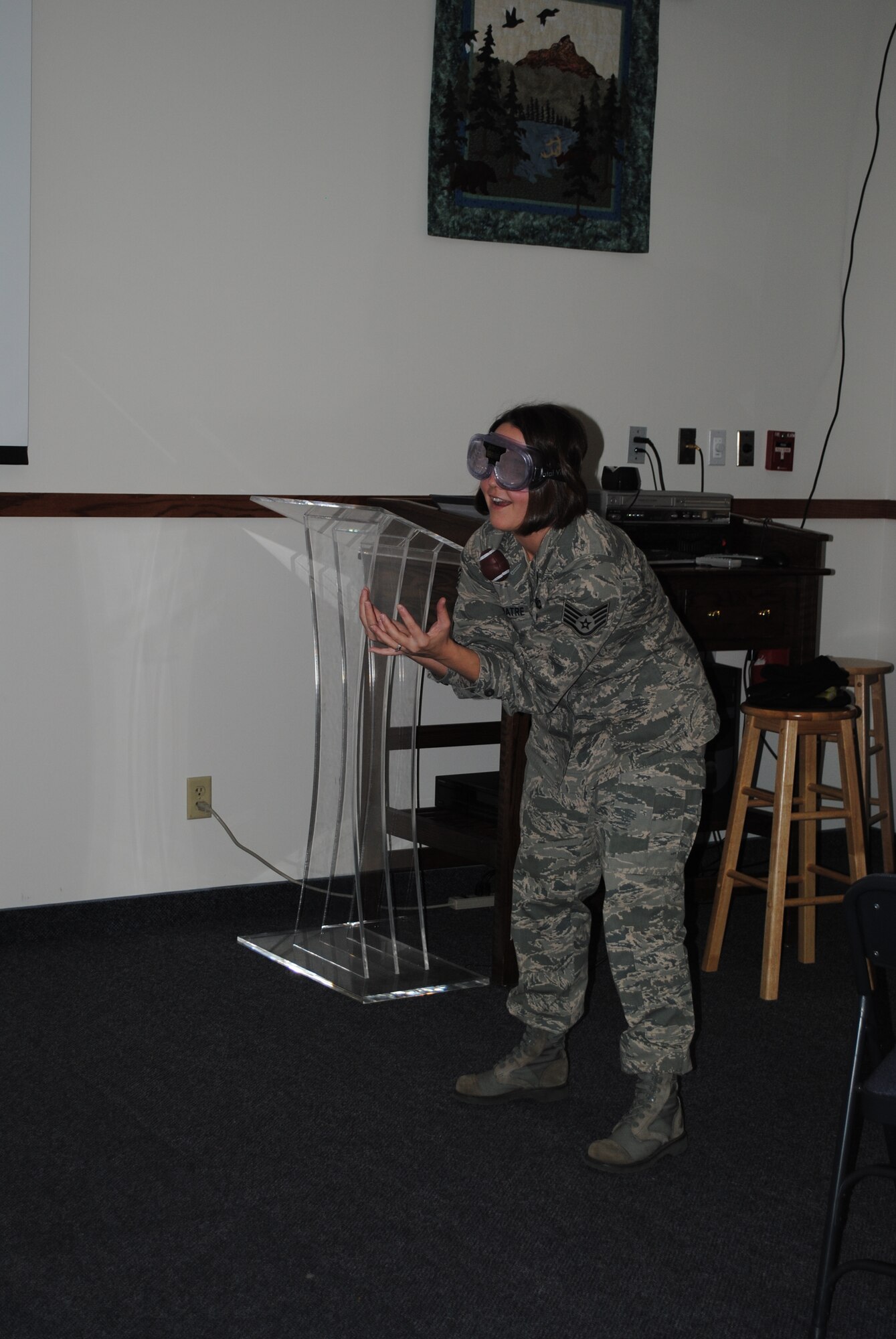 Staff Sgt. Melissa Clouatre, financial services representative with the 341st Comptroller Squadron, tries to catch a football a football while wearing beer googles during Wingman Day. (U.S. Air Force photo/Airman 1st Class Katrina Heikkinen)