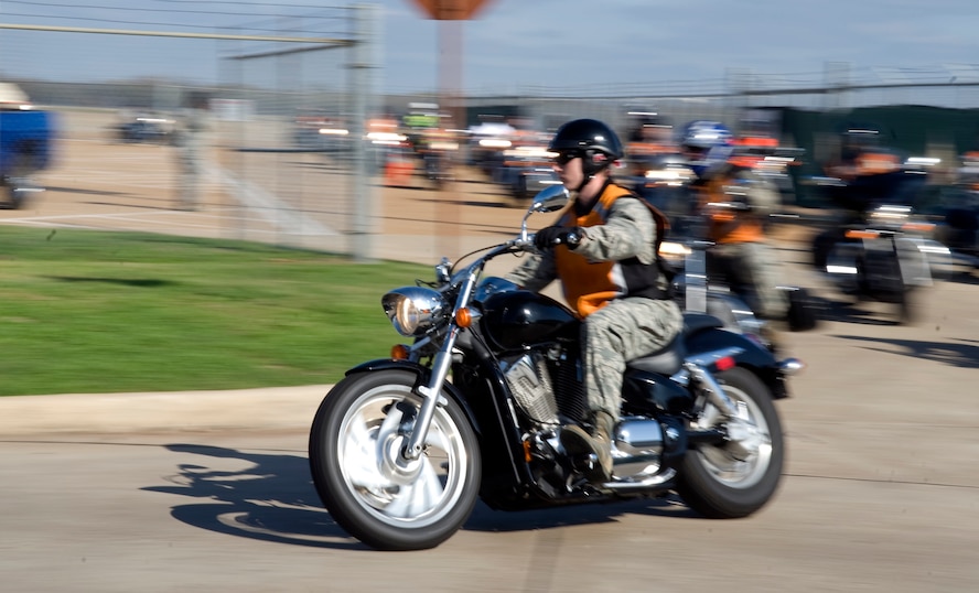Approximately 45 members of Team Barksdale kick off the motorcycle fun ride on Barksdale Air Force Base, La., Nov. 23. Motorcycle enthusiasts received a motorcycle safety briefing from Col Tim Fay, 2nd Bomb Wing commander, before heading out on an approximately 50 mile fun ride around base and Bossier City. The fun ride was organized to promote riding safety and to kick off the holiday season. (U.S. Air Force photo/Airman 1st Class Benjamin Gonsier)(RELEASED)