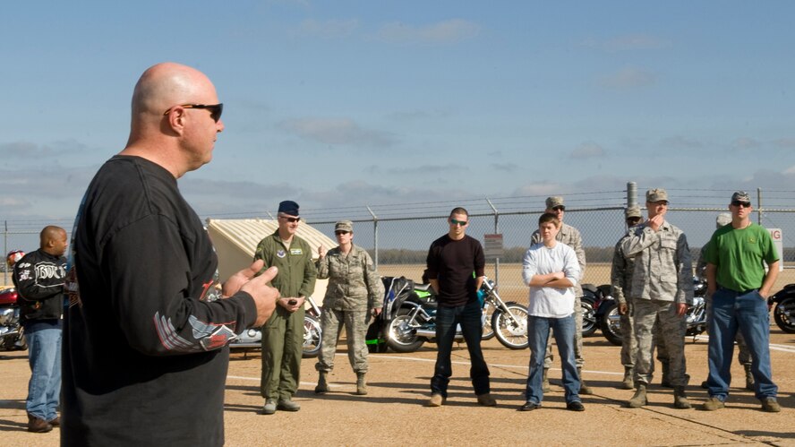 Members of Team Barksdale receive a briefing from Master Sgt. Ernest Pope, Air Force Global Strike Command, on motorcycle safety at Barksdale Air Force Base, La., Nov. 23. As a way to kick off the holiday weekend, Barksdale hosted a motorcycle fun ride around base and Bossier City for motorcycle enthusiasts. (U.S. Air Force photo/Airman 1st Class Benjamin Gonsier)(RELEASED)