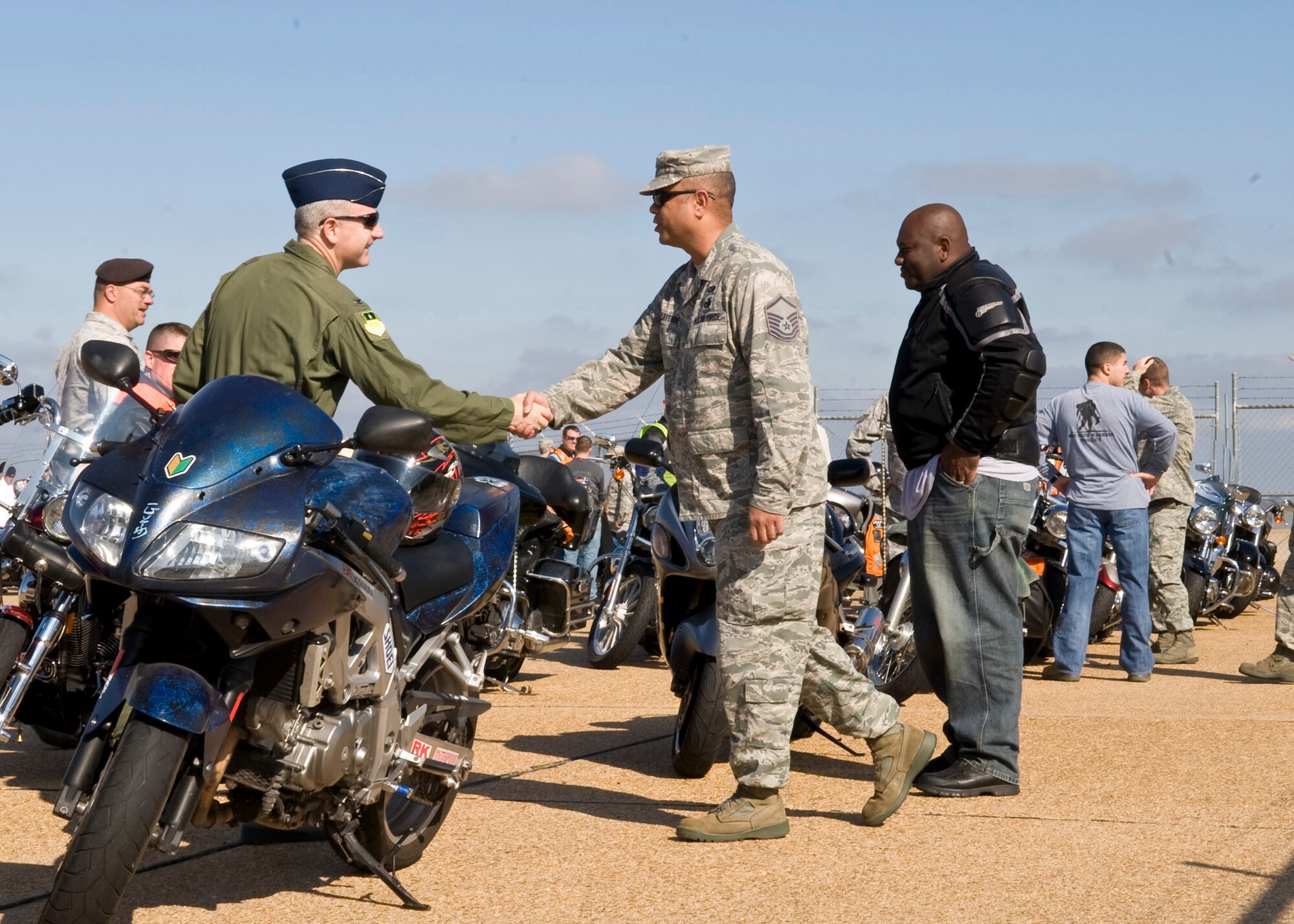 Col. Tim Fay, 2nd Bomb Wing commander, speaks to Barksdale Airmen participating in the Air Force Global Strike Command motorcycle mentorship fun ride on Barksdale Air Force Base, La., Nov. 23. The mentorship ride initially began as a way to kick off the Year of Motorcycle Safety in May. More than 45 motorcyclists showed up to participate in the fun ride. (U.S. Air Force photo/Airman 1st Class Benjamin Gonsier)(RELEASED)