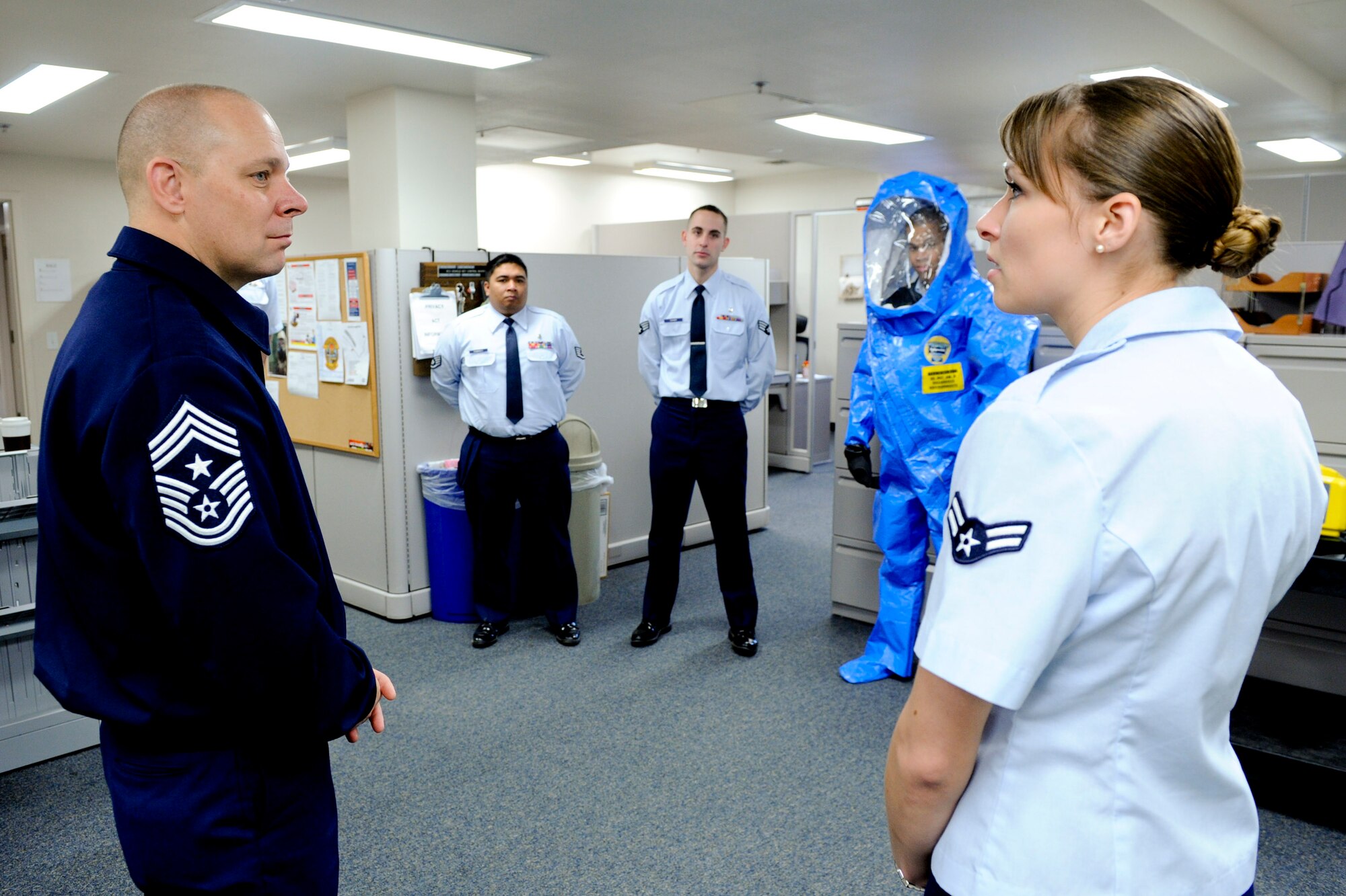 VANDENBERG AIR FORCE BASE, Calif. -- Chief Master Sgt. Dennis L. Vannorsdall, the 14th Air Force command chief, speaks to Airman 1st Class Friederike Benndorf, a 30th Medical Operations Squadron bioenvironmental engineer, about the mission and duties of the bioenvironmental engineering element at the medical clinic here Monday, Nov. 28, 2011. Vannorsdall was touring the 30th Medical Group as part of a base integration tour for his recent arrival as top enlisted member of the 14th Air Force. (U.S. Air Force photo/Staff Sgt. Levi Riendeau)
