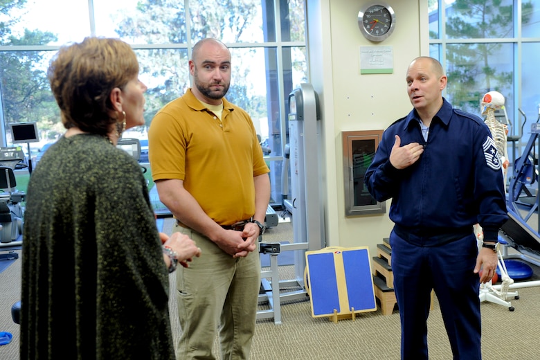 VANDENBERG AIR FORCE BASE, Calif. -- Chief Master Sgt. Dennis L. Vannorsdall, right, the 14th Air Force command chief, speaks with Jonathon Low, the Health and Wellness Center health promotion program manager, and Melinda Reed, the Health and Wellness Center registered dietician, at the medical clinic here Monday, Nov. 28, 2011. Vannorsdall was touring the 30th Medical Group as part of a base integration tour for his recent arrival as top enlisted member of the 14th Air Force. (U.S. Air Force photo/Staff Sgt. Levi Riendeau)