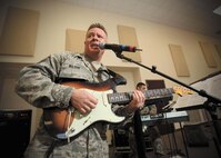 Master Sgt. Steve Wilson, vocalist and guitarist with Warhawk, the U.S. Air Force Band of the West ensemble, rehearses for an upcoming performance at the Luke AFB Air Force Ball. (U.S. Air Force photo/Robbin Cresswell)